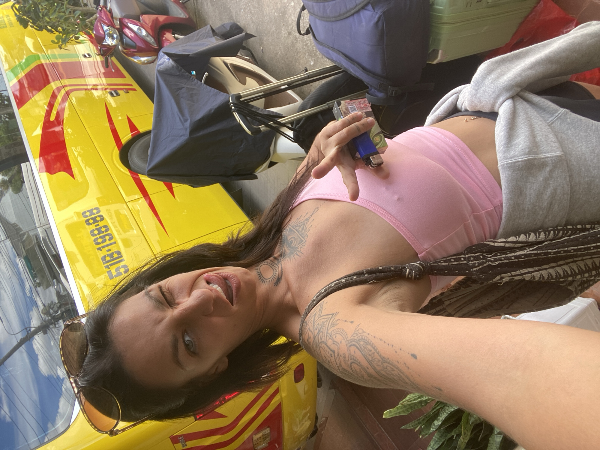 Selfies by a yellow bus and bamboo greenery in Đà Lạt