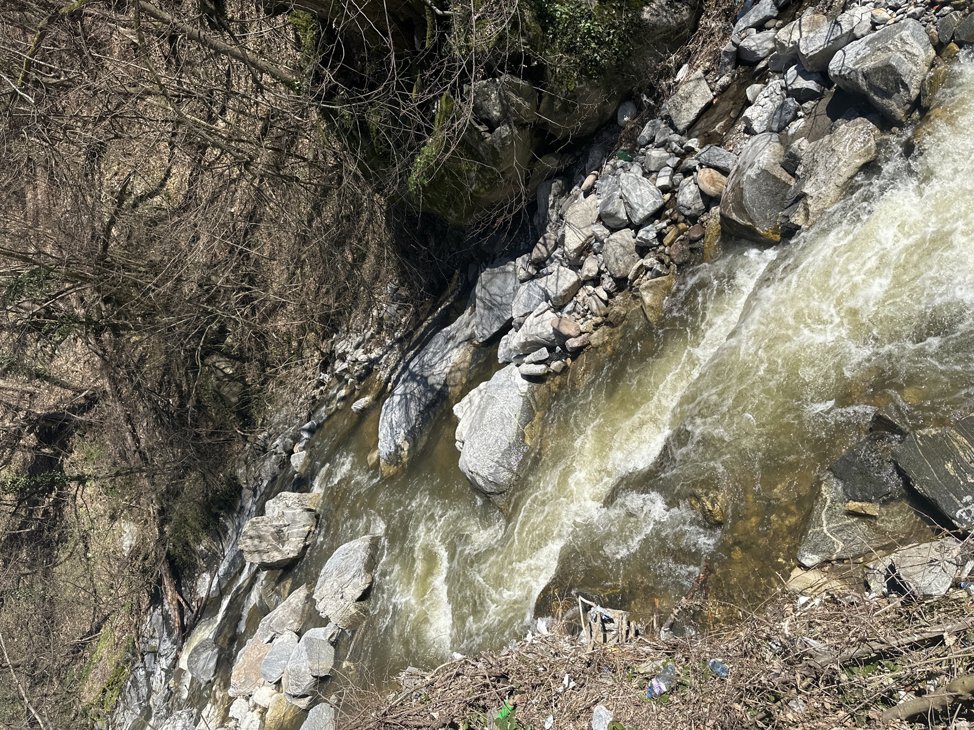Fast-flowing stream observed in rocky ravine near Peshtera, Bulgaria