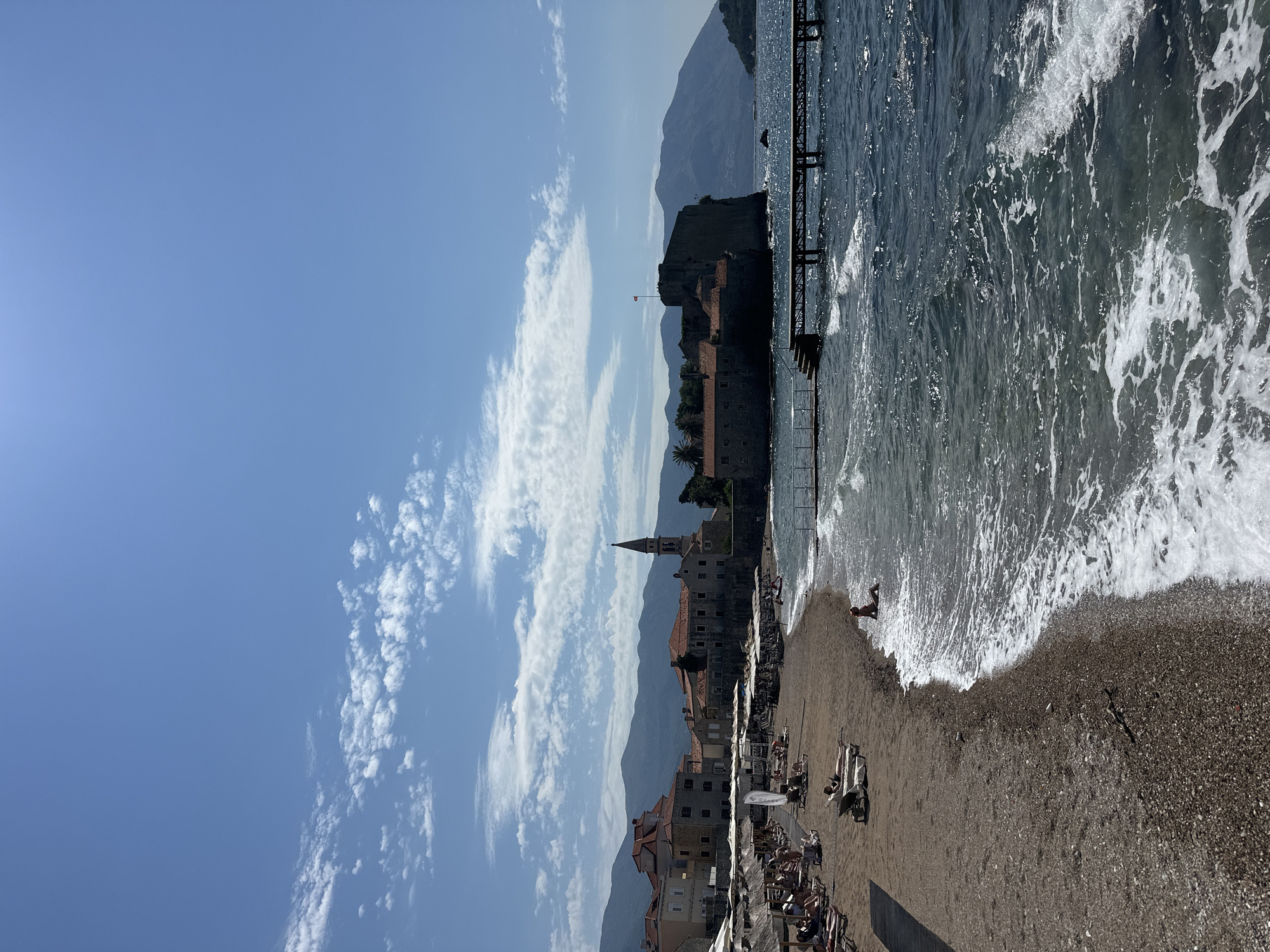 Summer morning unfolds in Budva: tourists, musicians, beach life