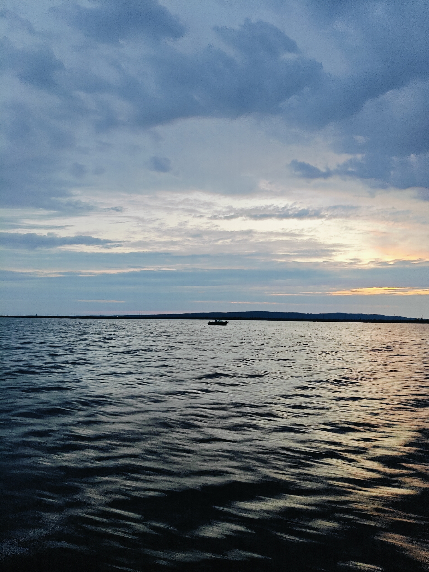 Overcast evening on the waterfront near Chaikovsky, Russia