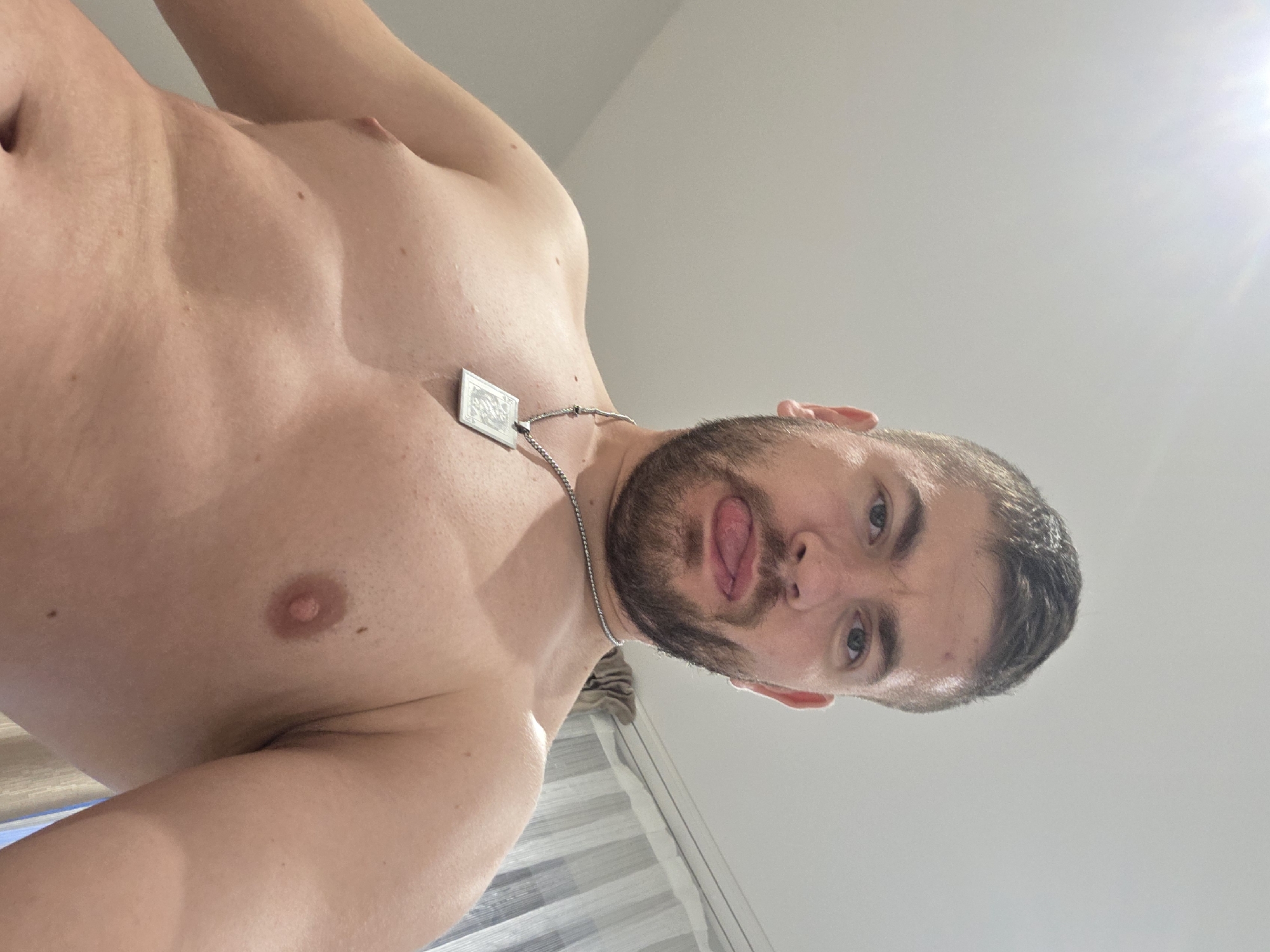 Man poses playfully for photos in Bulgarian home