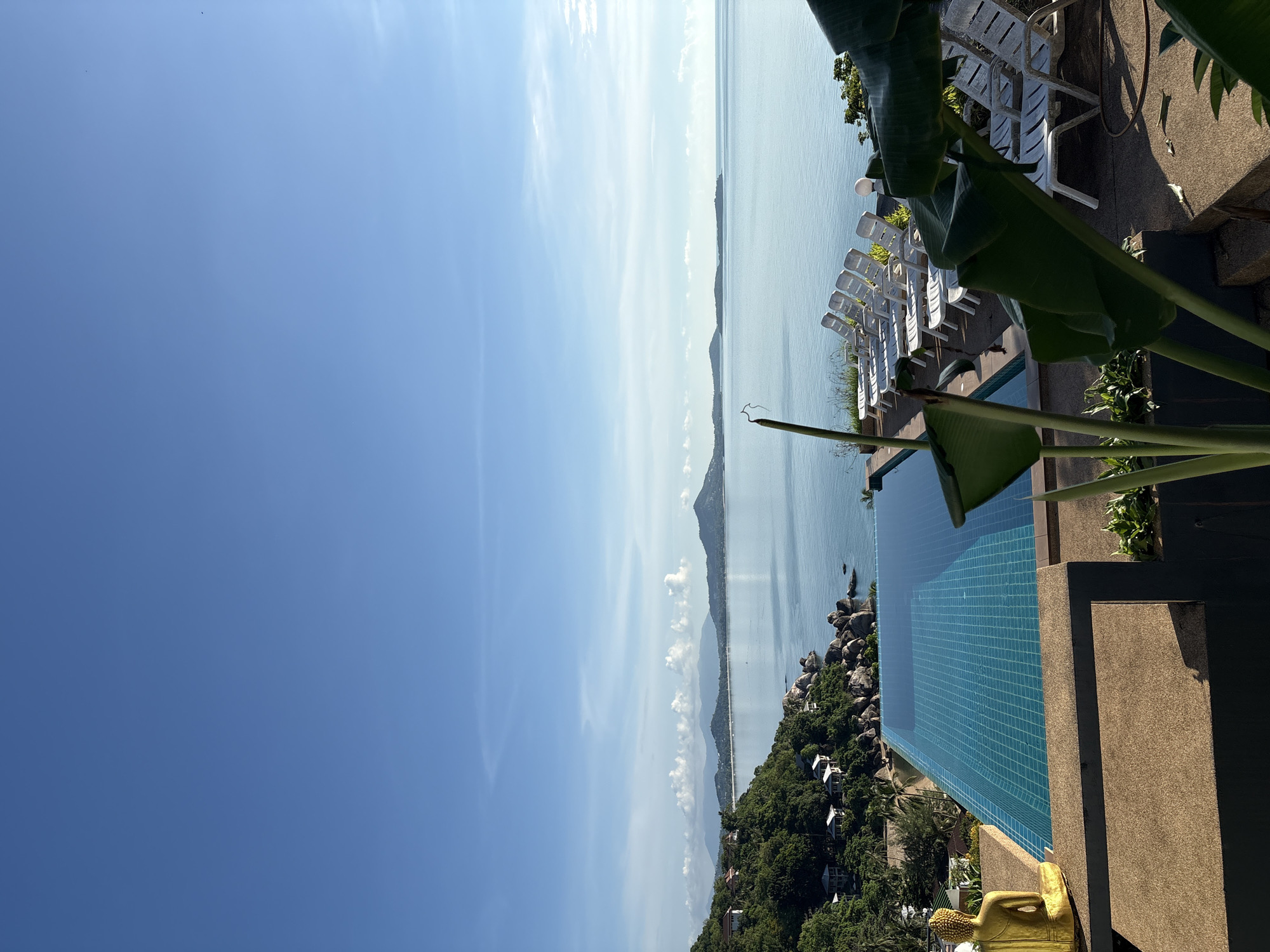 Ko Samui hillside exploration with Buddha statue and luxury homes