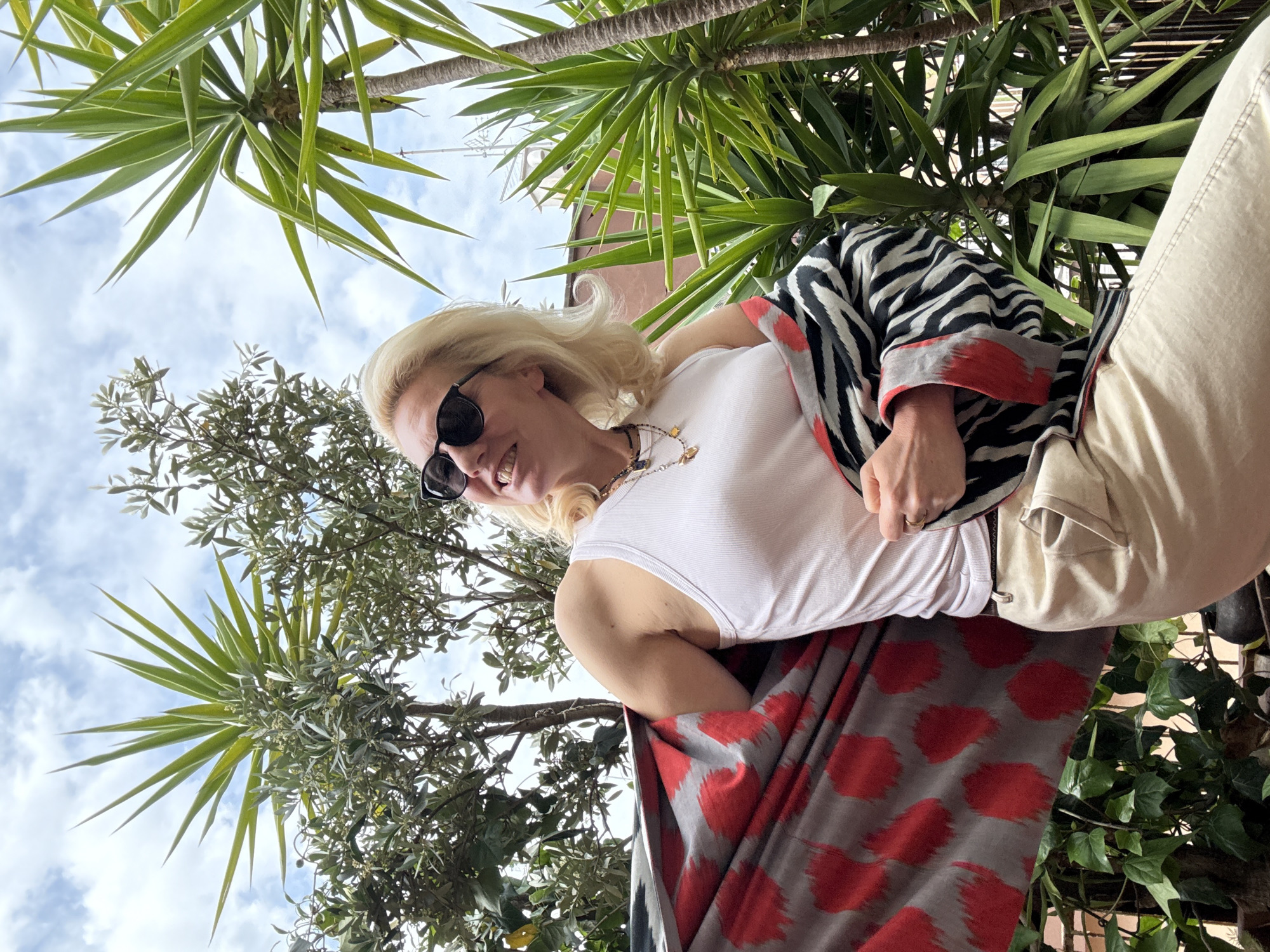 Woman poses for photos in patterned outfit in Rome