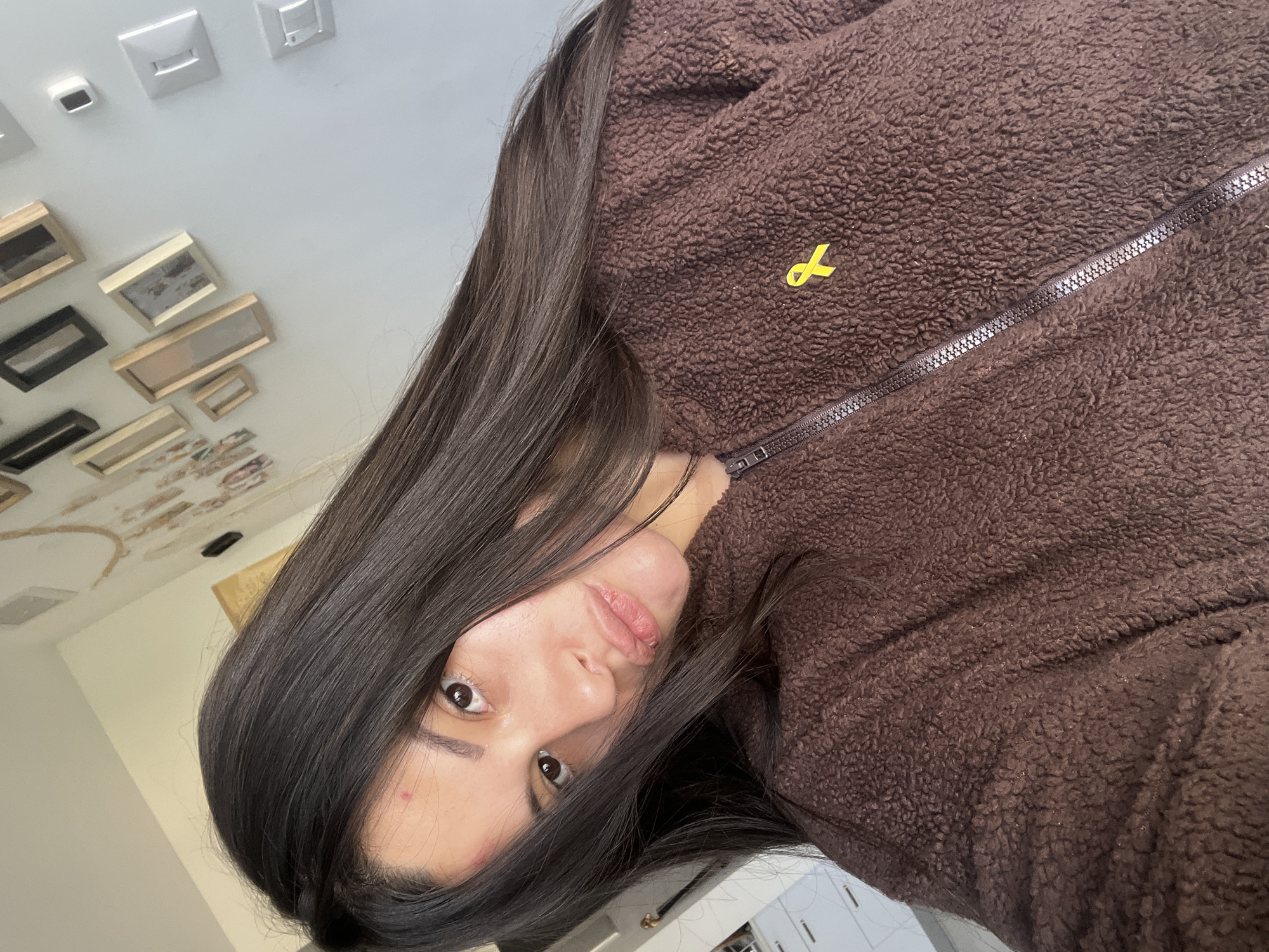 Two women take selfies indoors in Kiryat Bialik