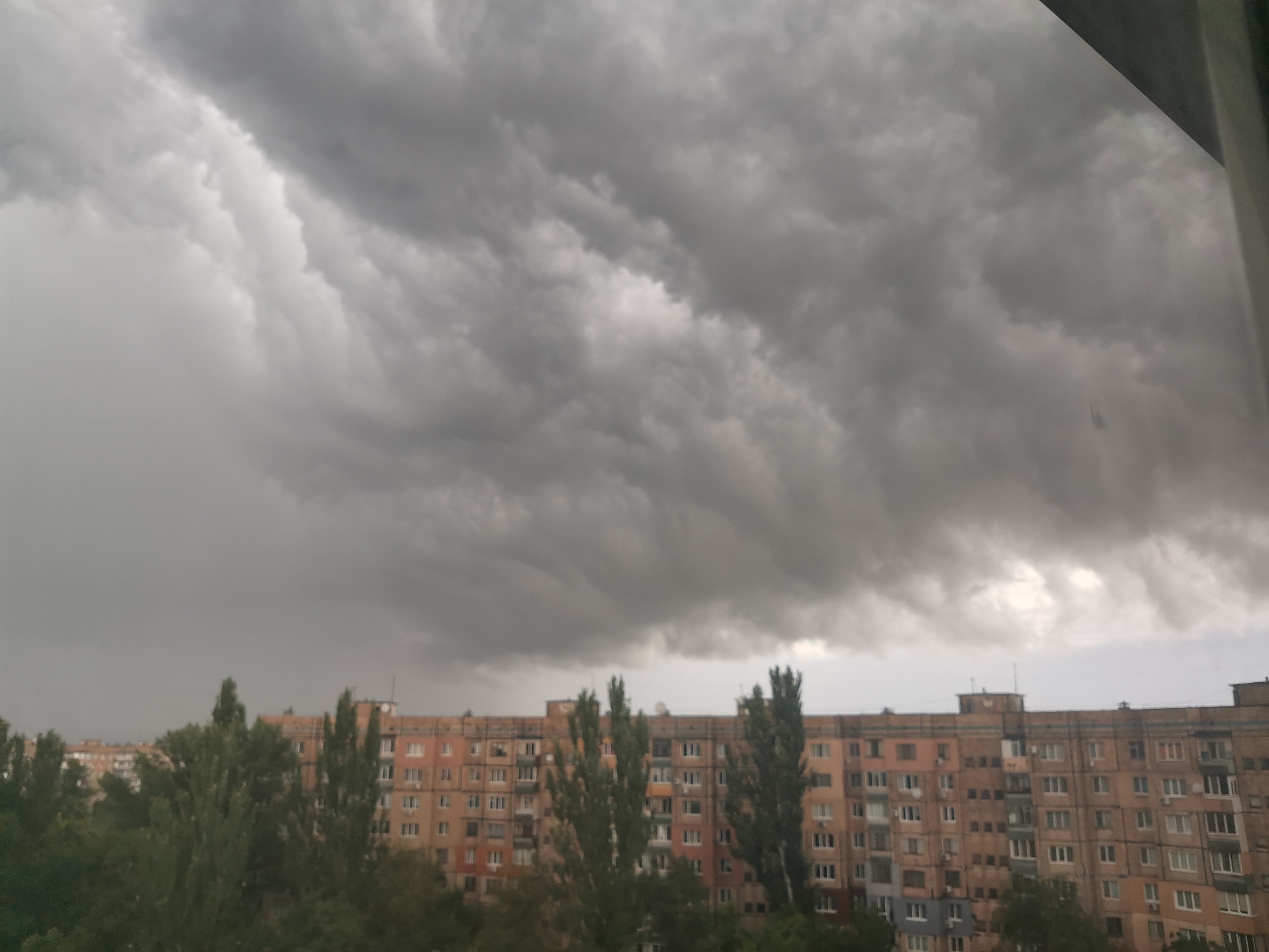 Storm clouds gather over Kryvyi Rih apartment blocks