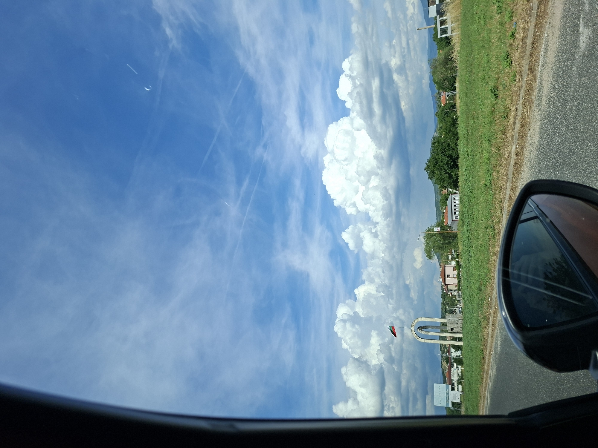 Clear blue sky viewed from car interior in Banya