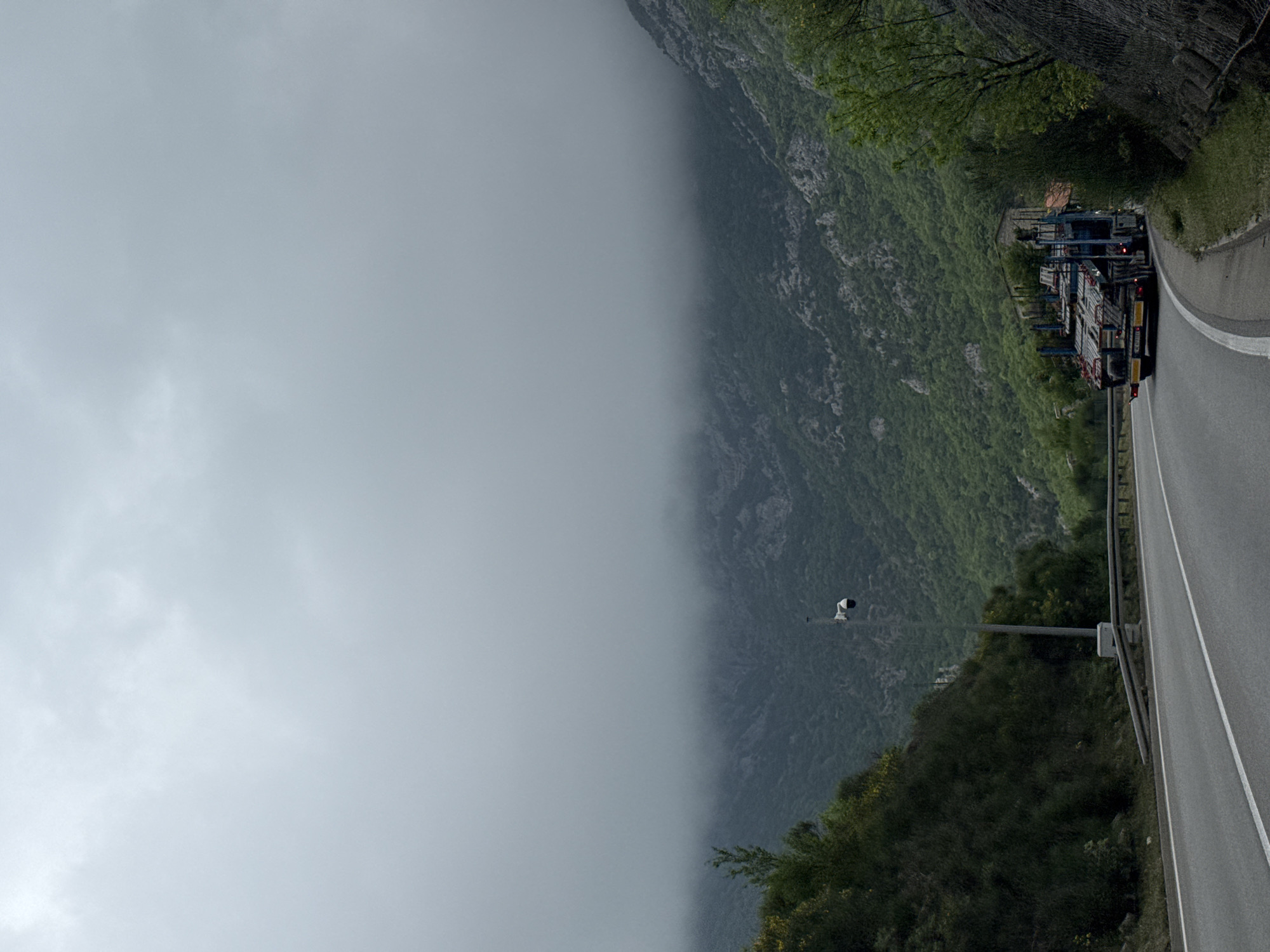 Morning fog blankets mountain road in Montenegro