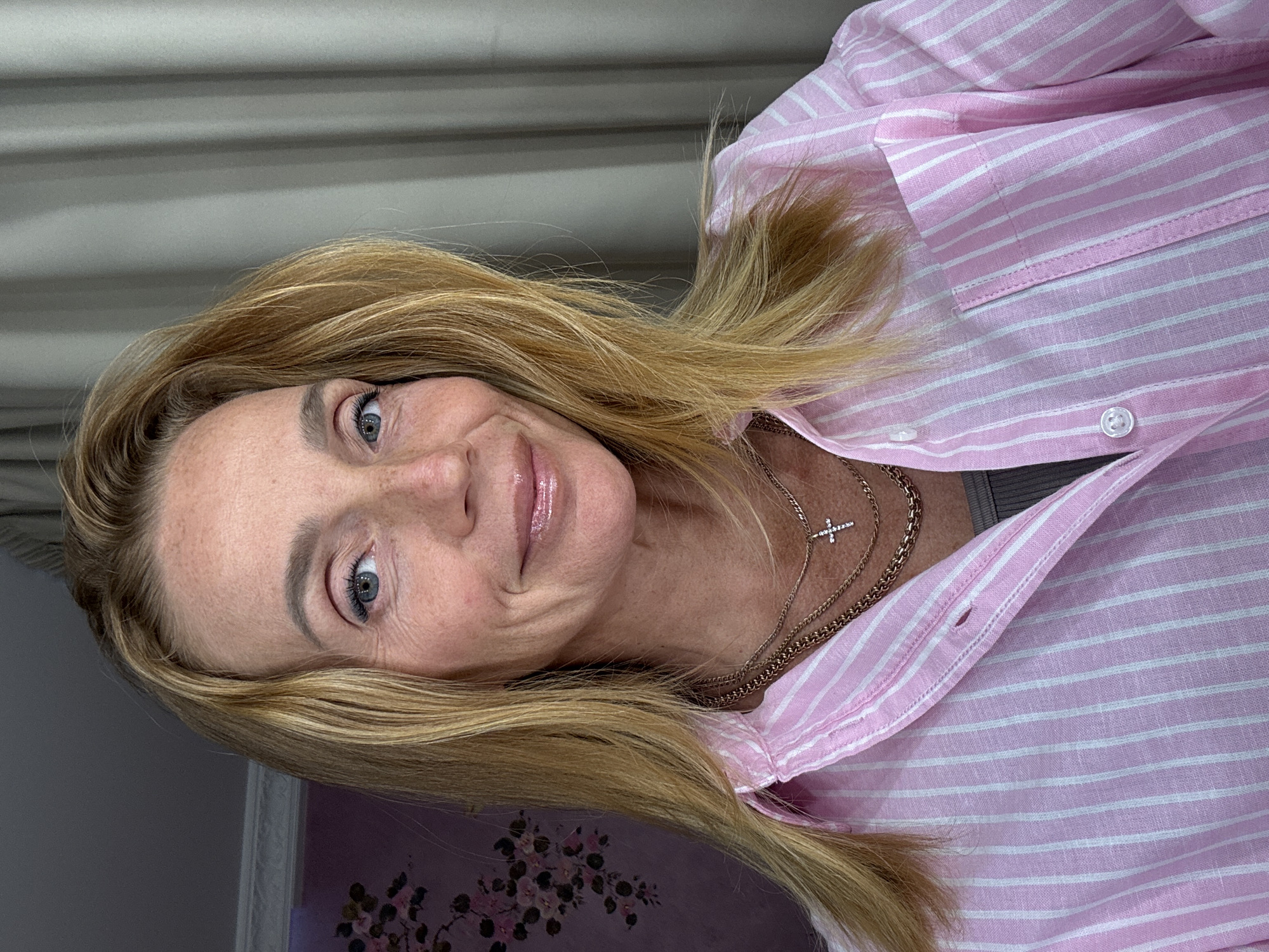 Woman takes mirror selfie at home in Saint Petersburg