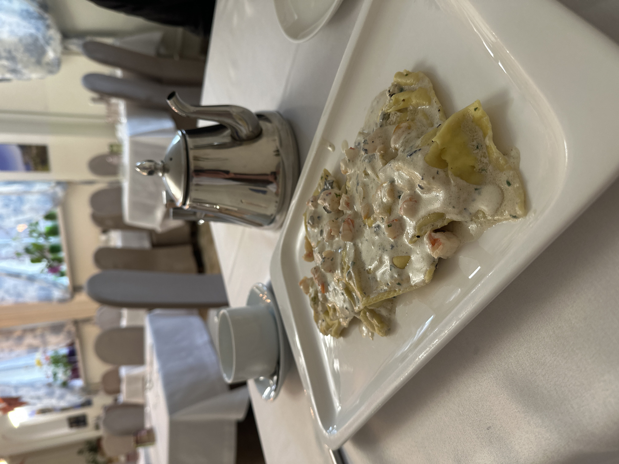Lunch documented at upscale restaurant with pasta and pizza