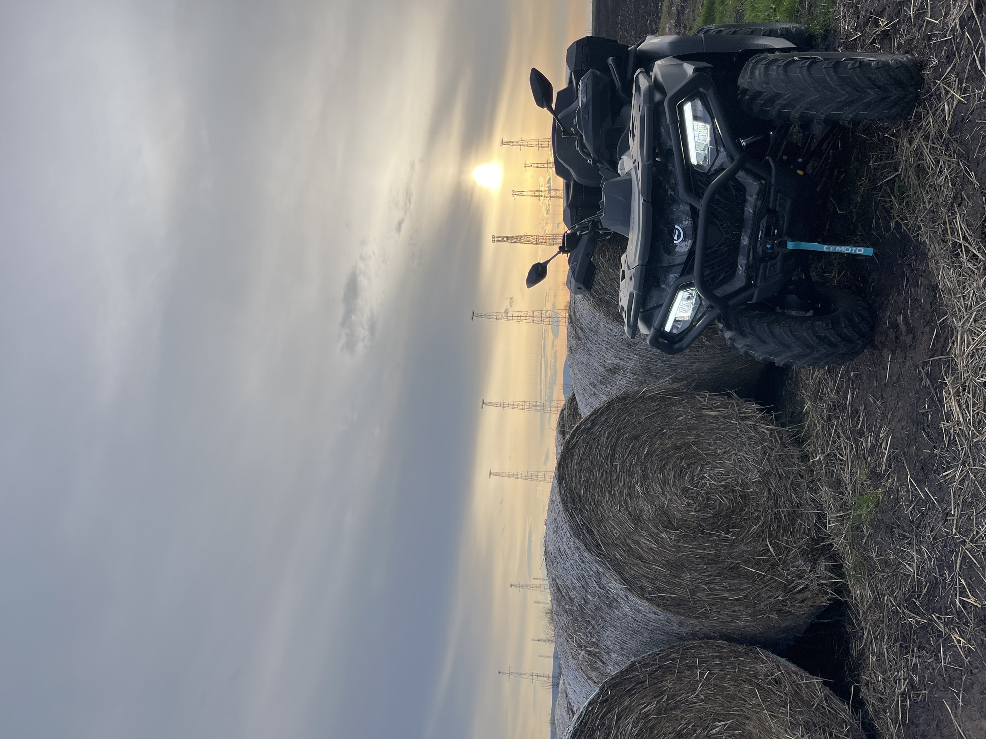 ATV parked among hay bales in Bulgarian field