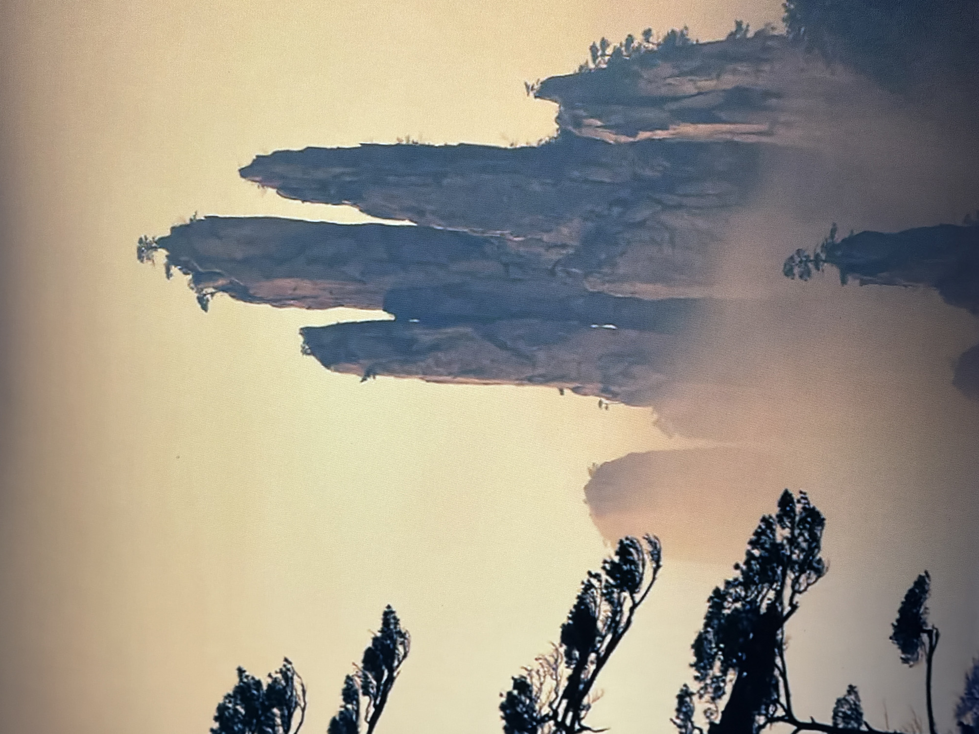 Floating rock formations observed in hazy landscape