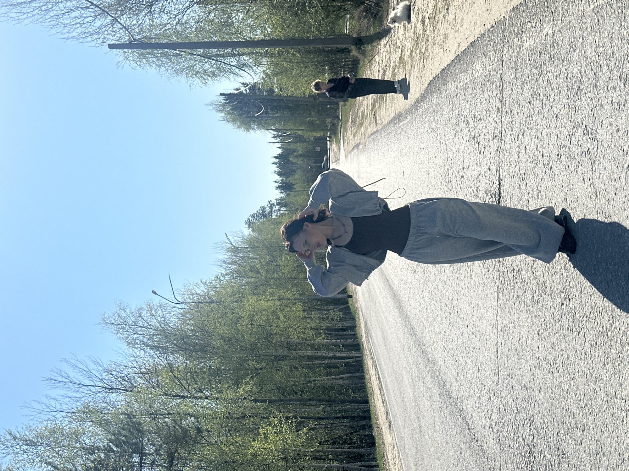 Two women take selfies outdoors in Высокий, Russia