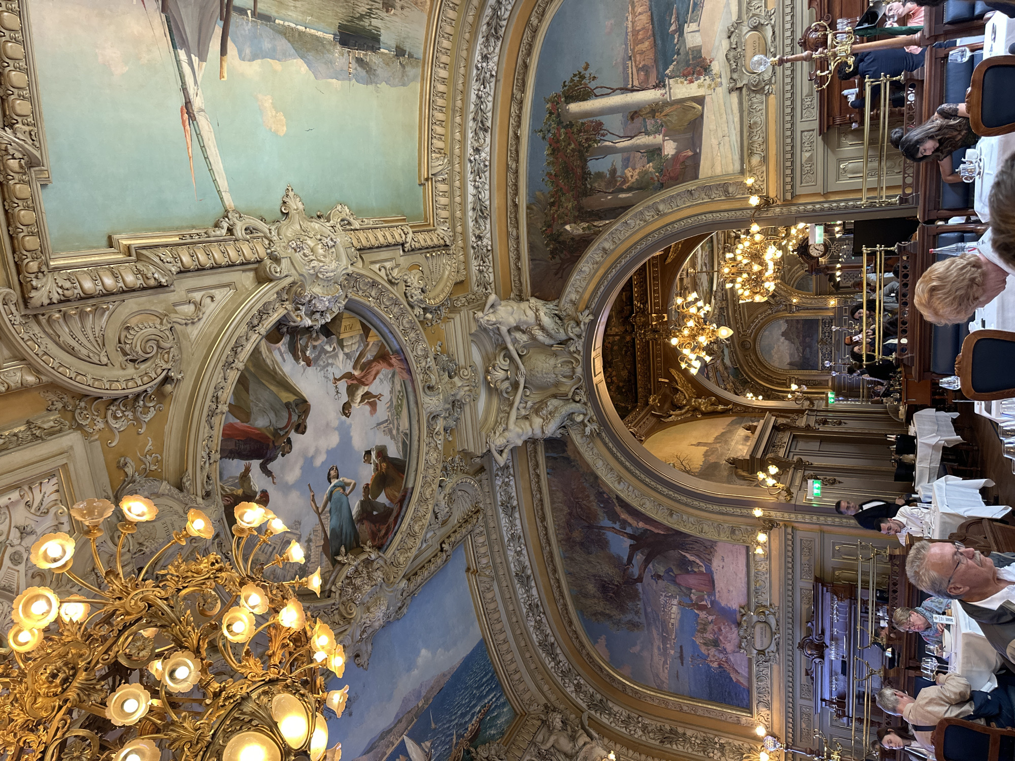 Luxury dining experience documented at ornate Parisian restaurant