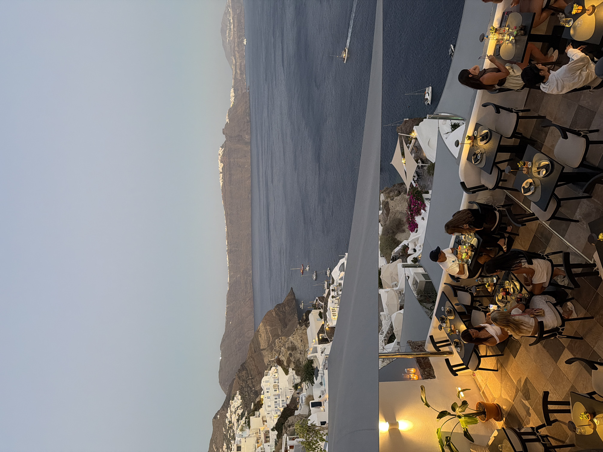 Oia, Santorini glows as dusk fades into night