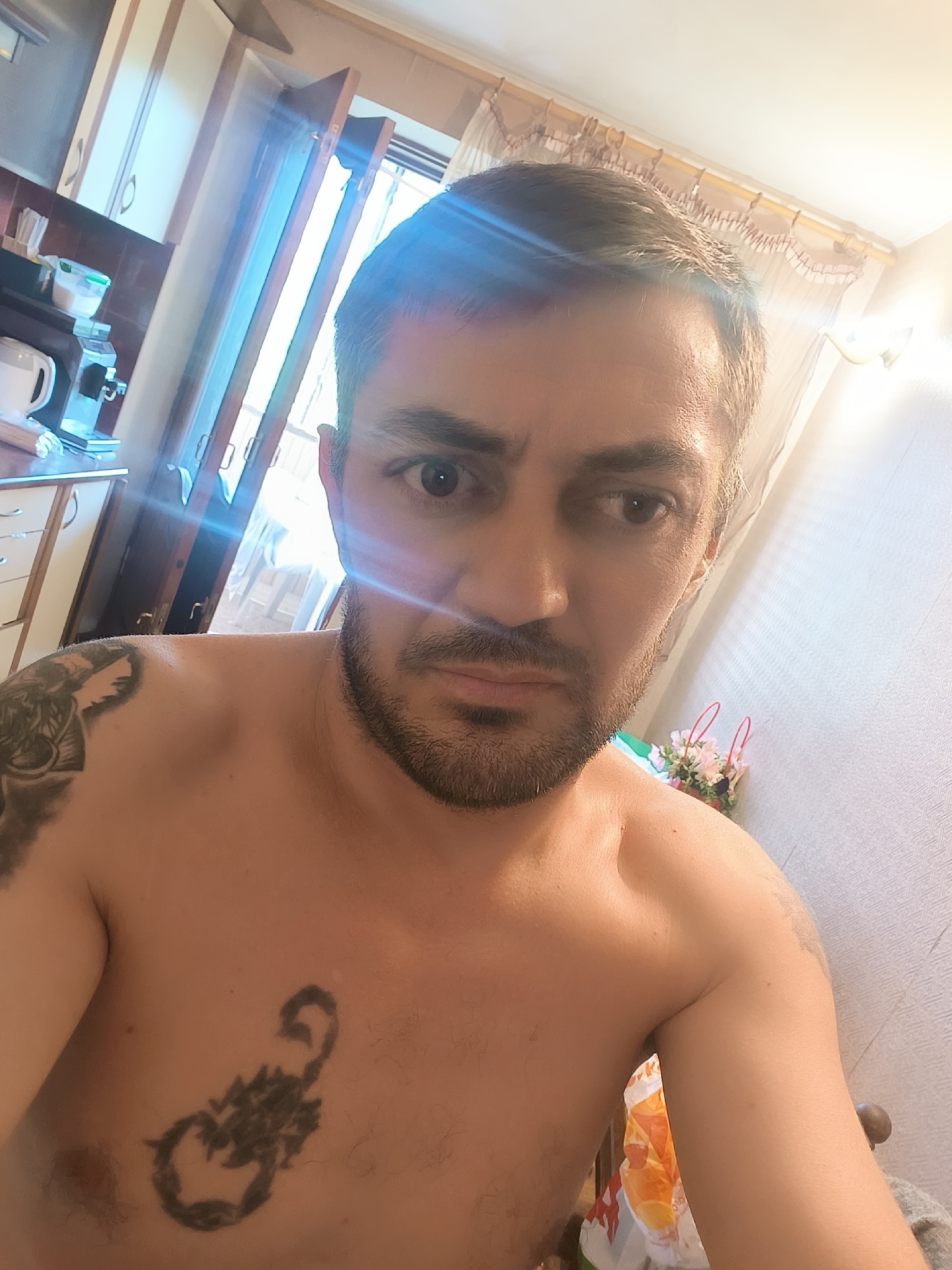 Odesa morning: tattoos, a toddler on a toy car, apartment skyline