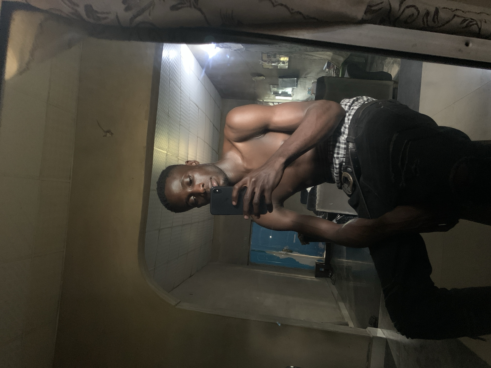 Man Takes Selfies in Gbeleko Building