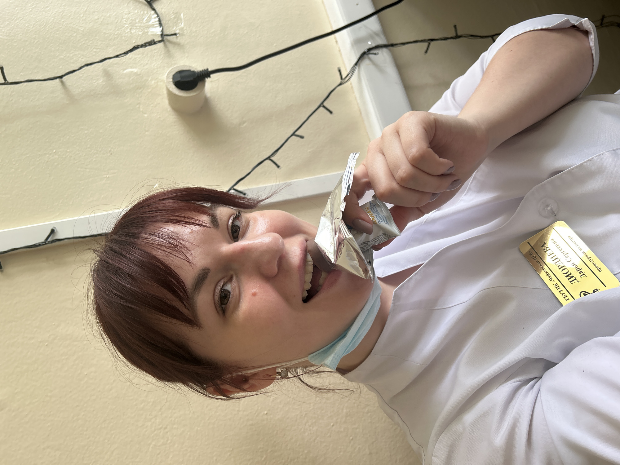 Healthcare worker takes snack break in Фоки, Russia