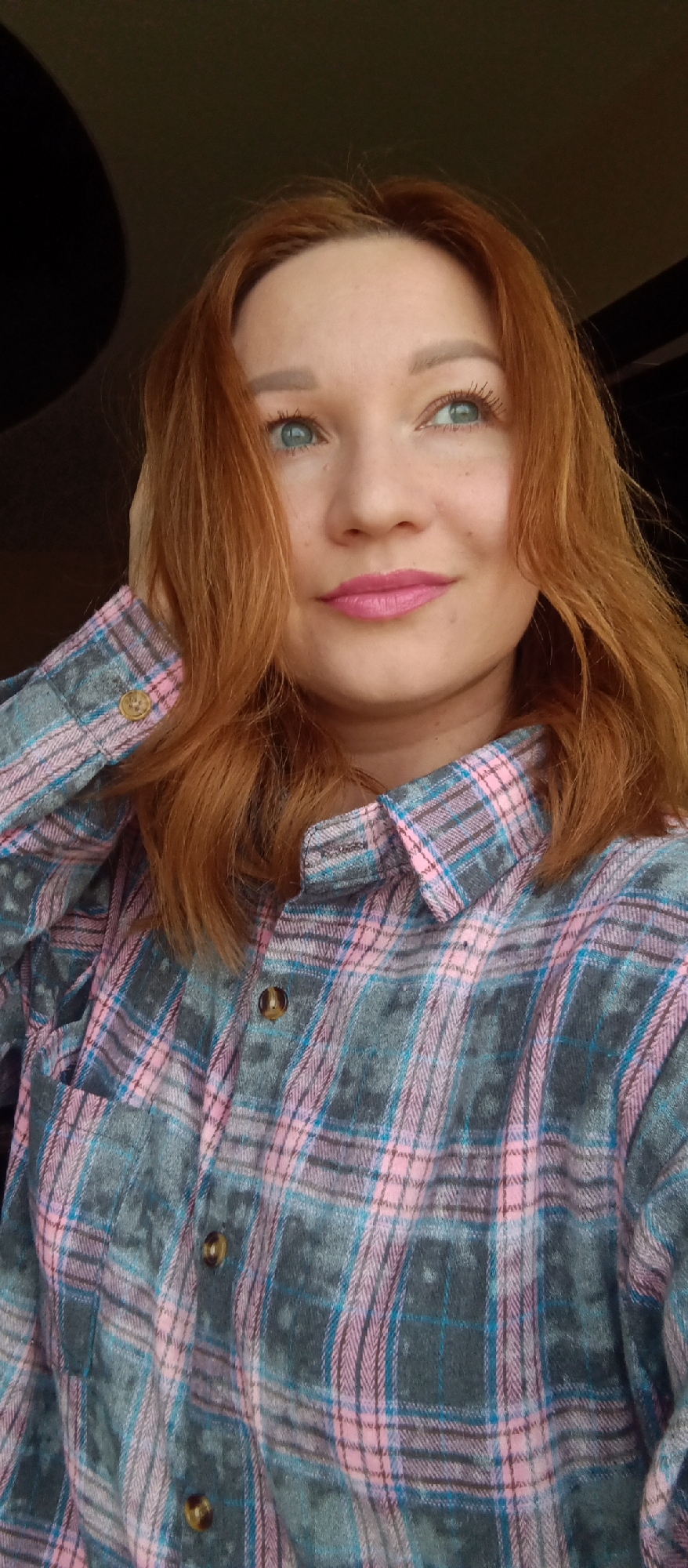 Red-haired woman photographed multiple times in morning portrait session