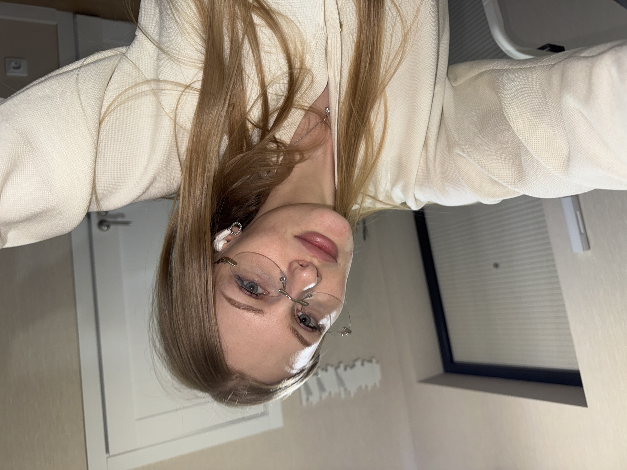 Young woman with glasses photographed twice in Perm, Russia