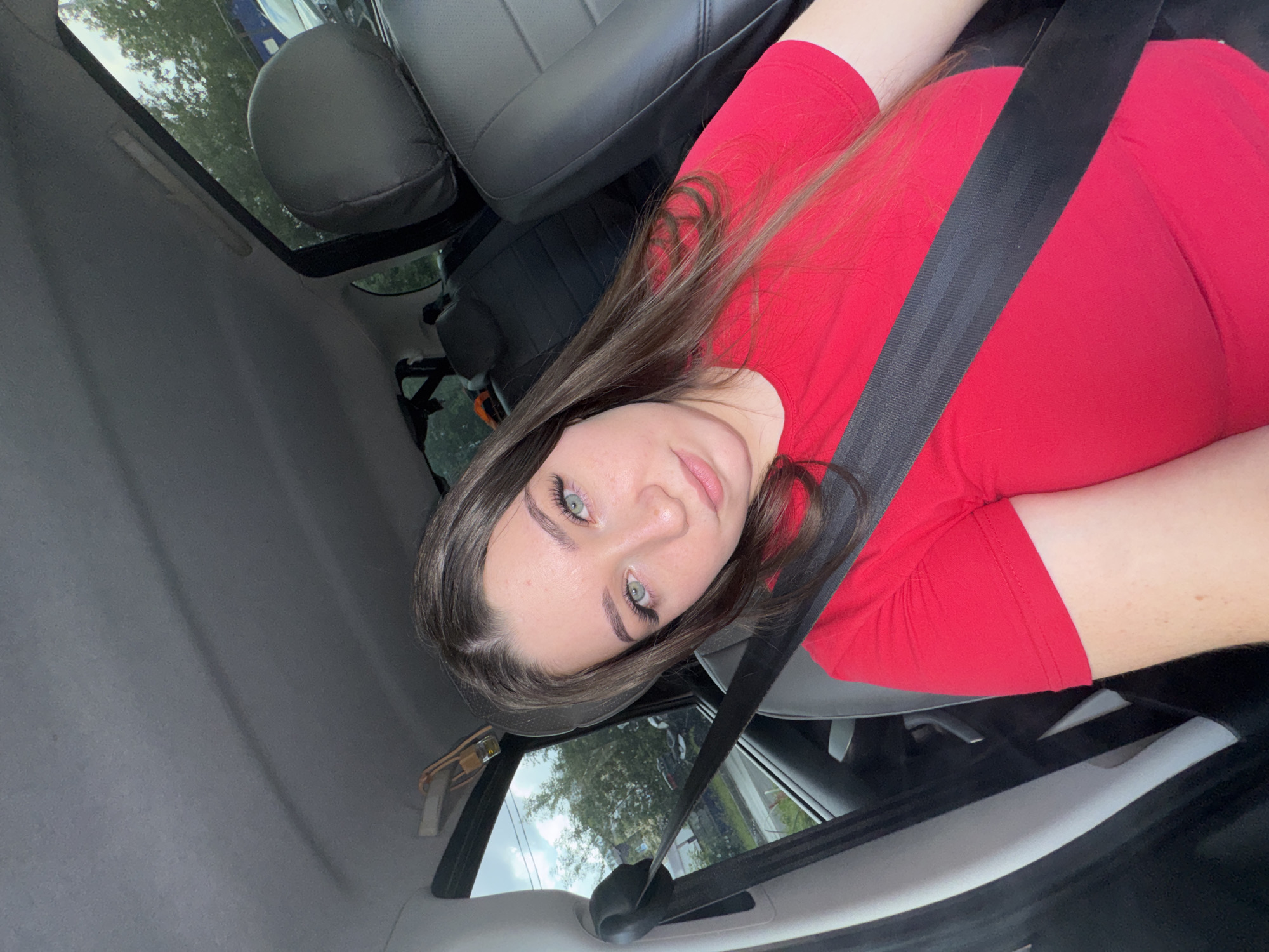 In-car selfie session in Perm, red t-shirt, June 2026