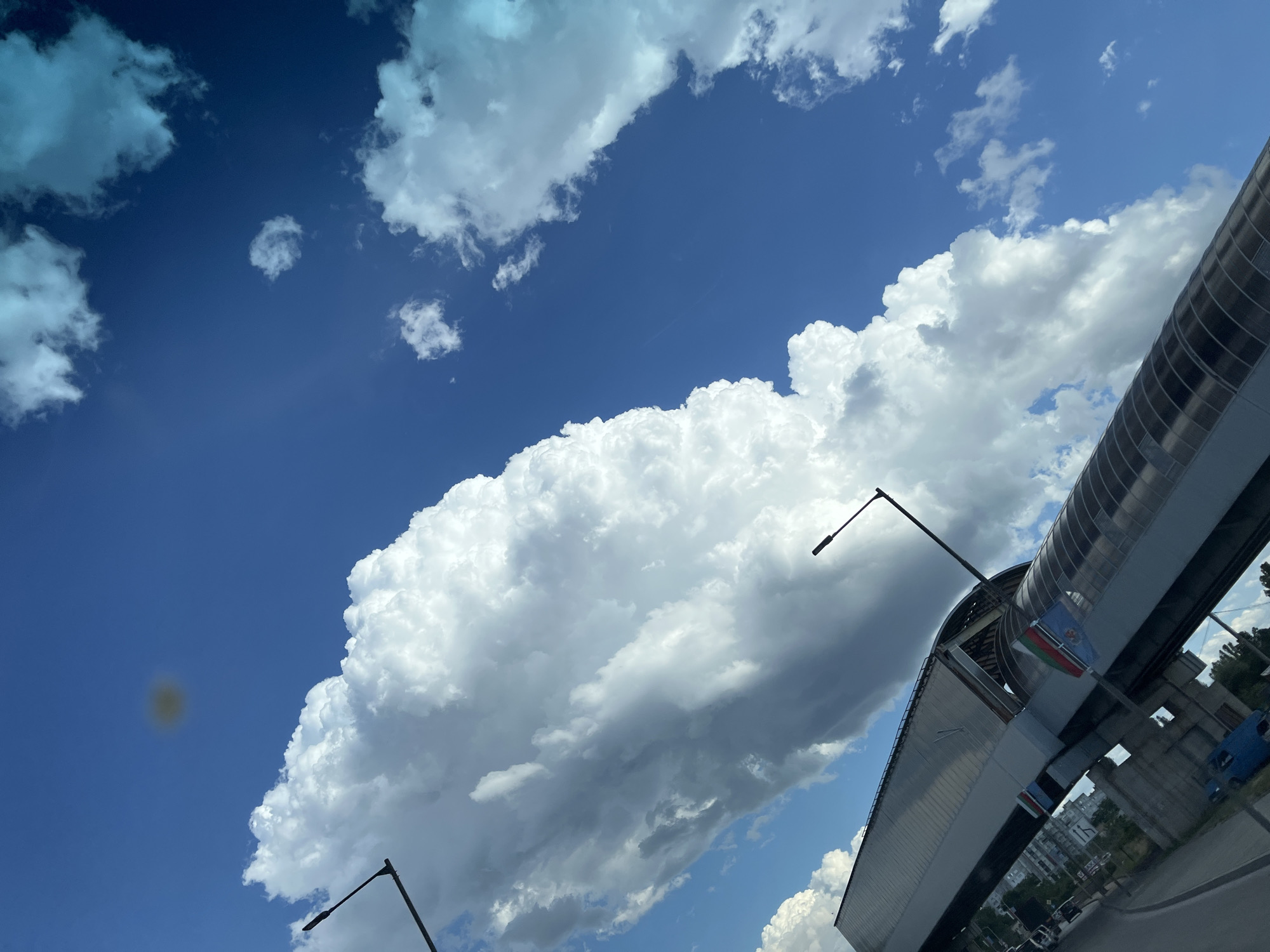 Dramatic cloud formations over urban streets and infrastructure