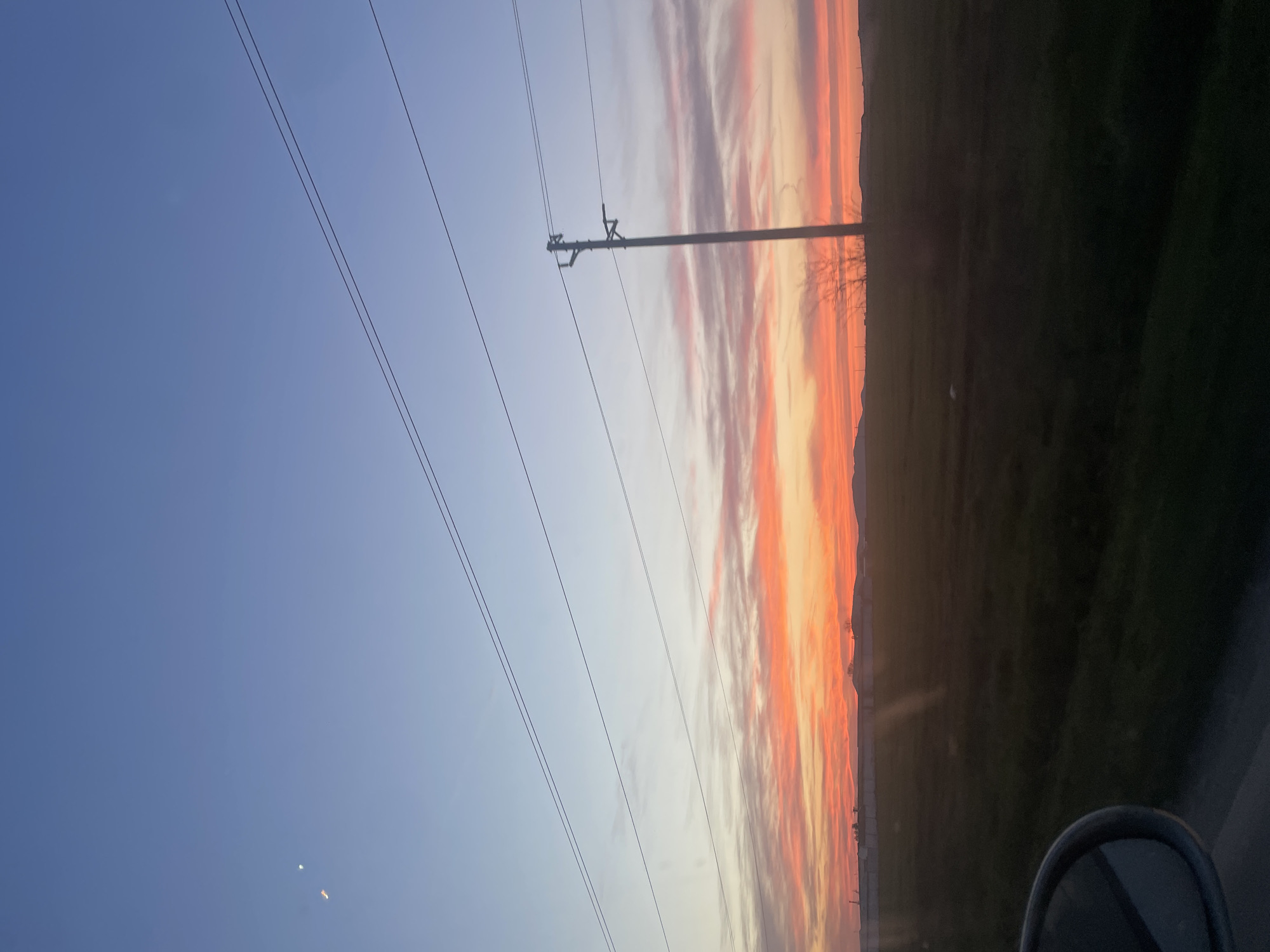 Sunset observed over Ravda, Bulgaria power lines