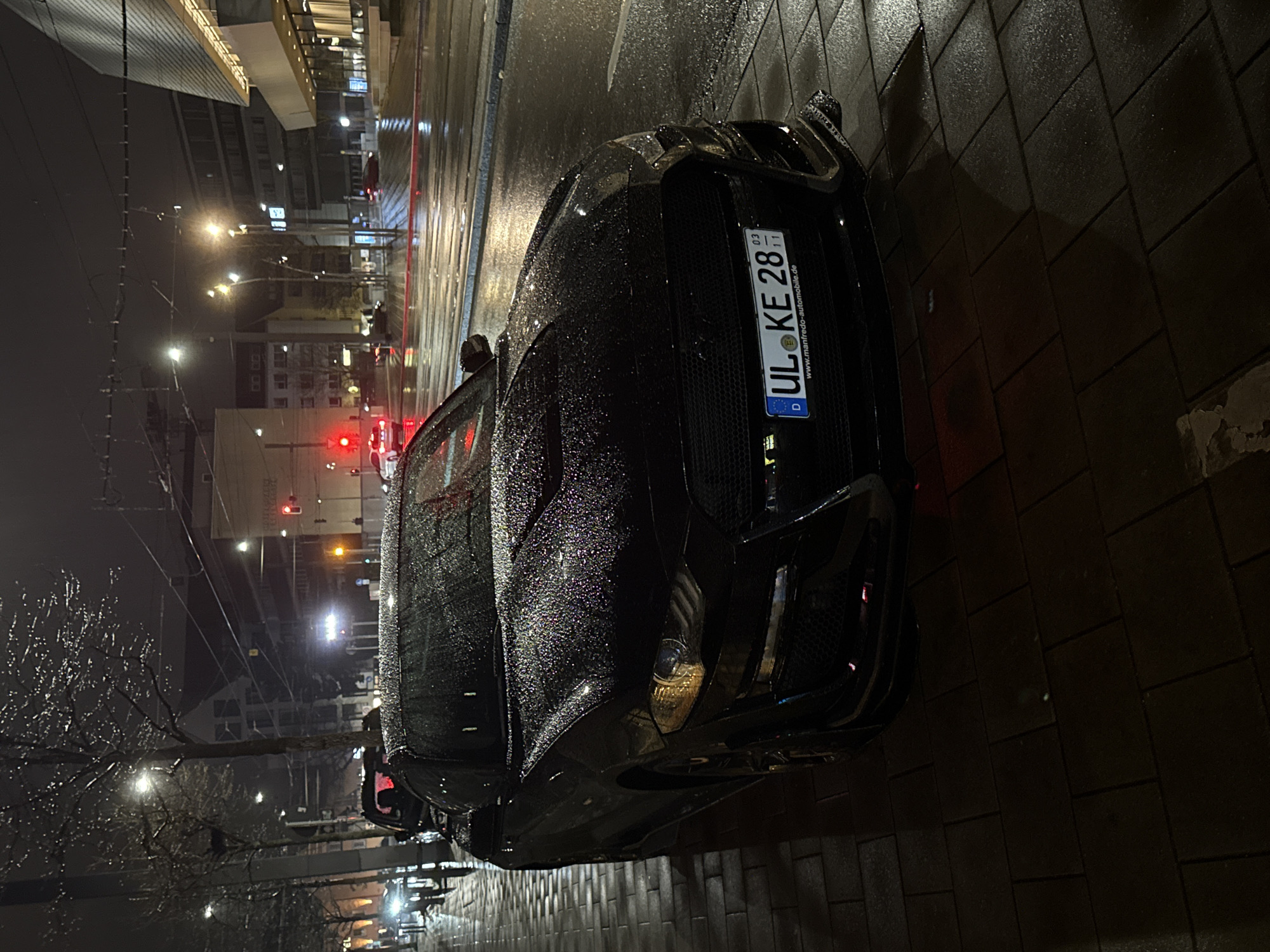 Sports car parked on wet street in Ulm