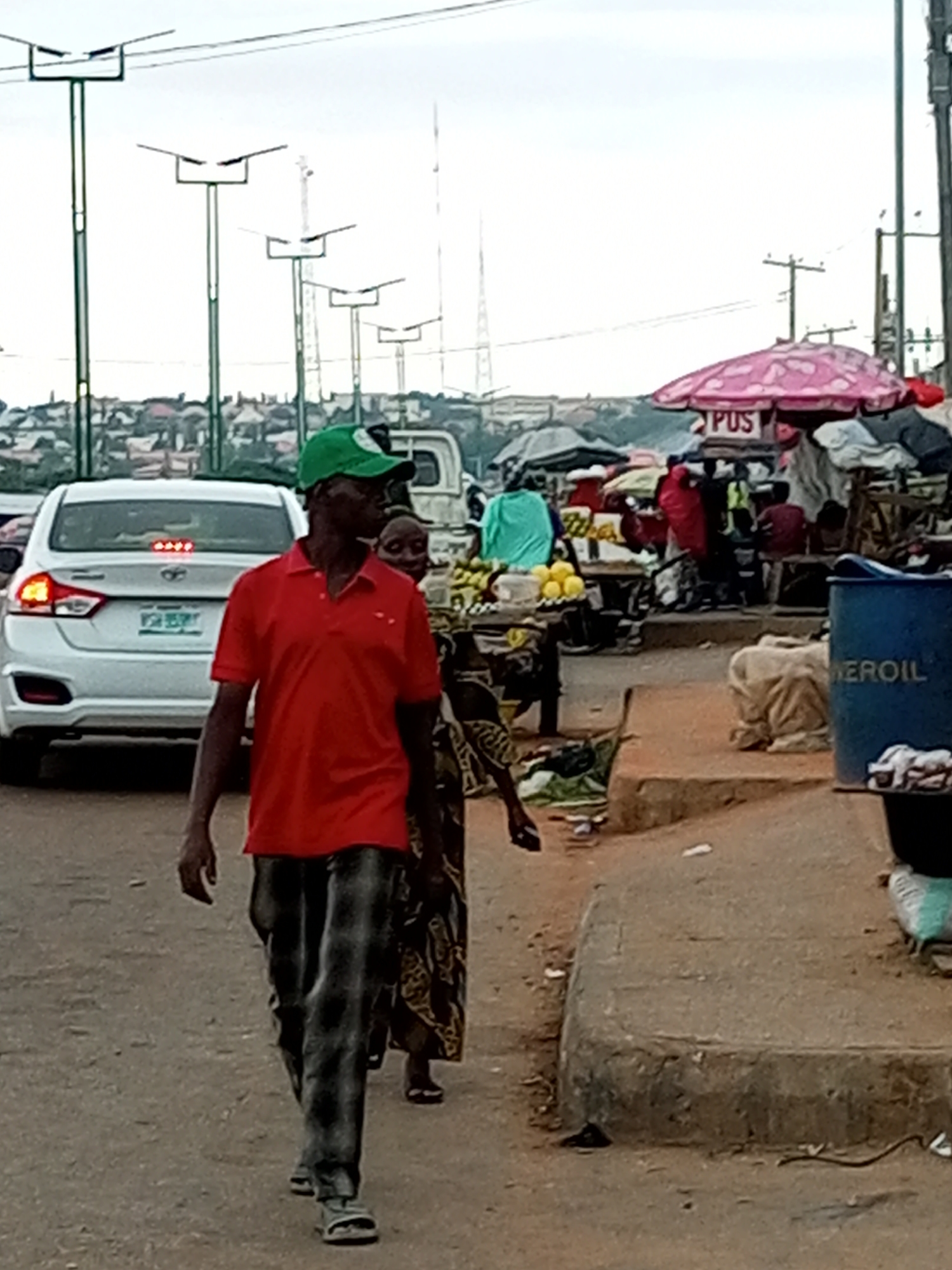 Daily street life in northern Nigerian cities during rainy season