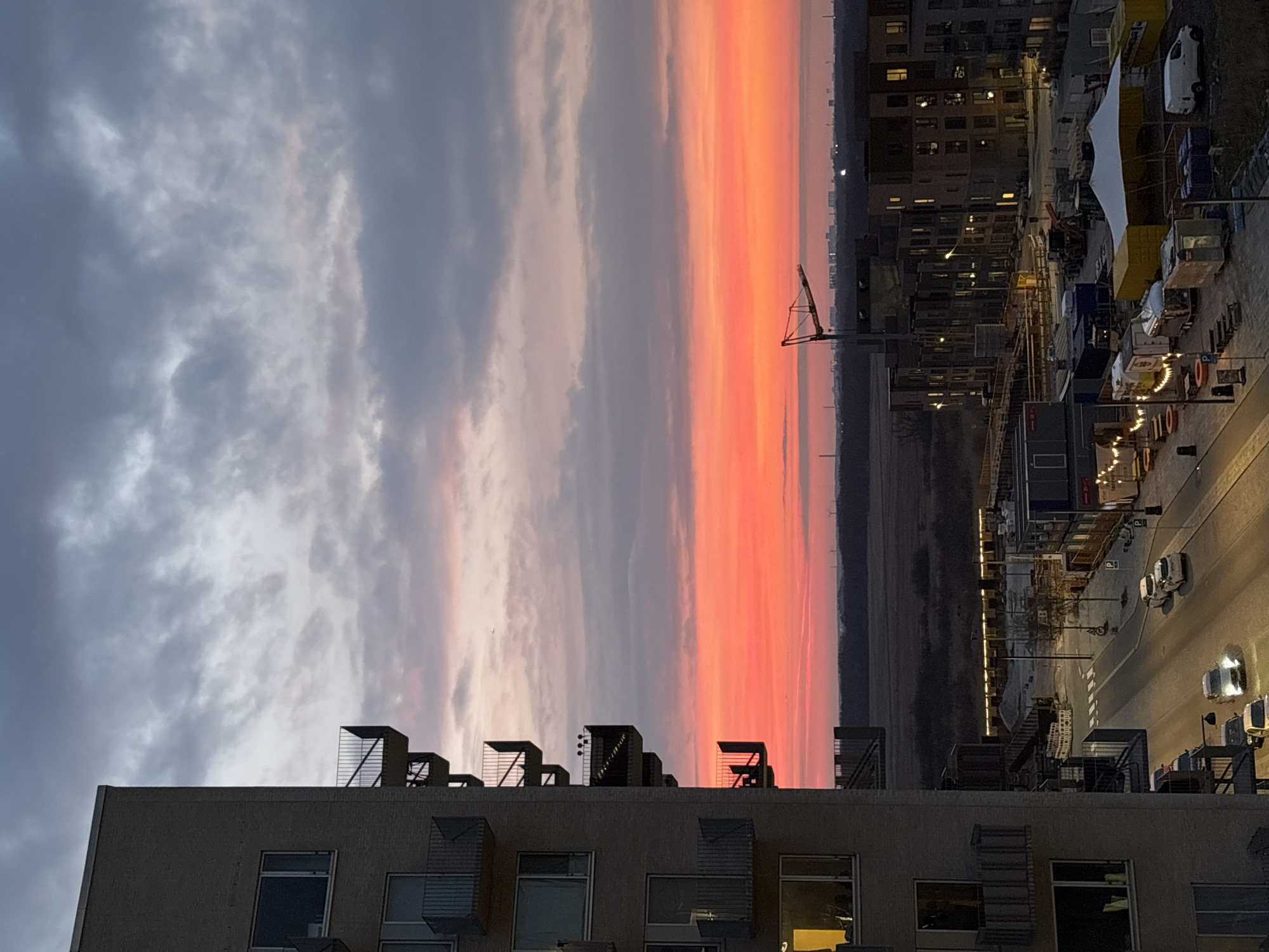 Sunset captured over Copenhagen rooftops and industrial buildings