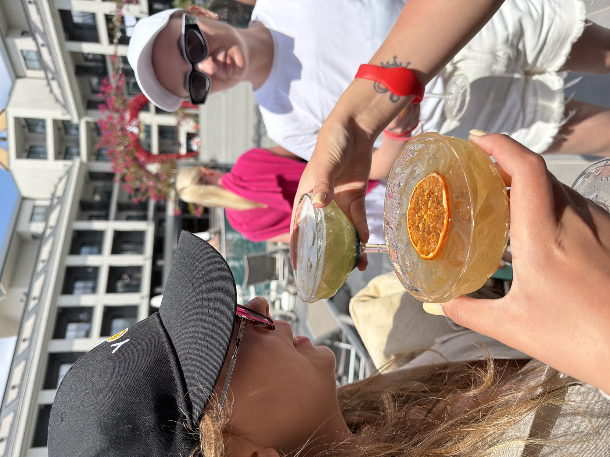 Women toast cocktails at modern Serik hotel lounge