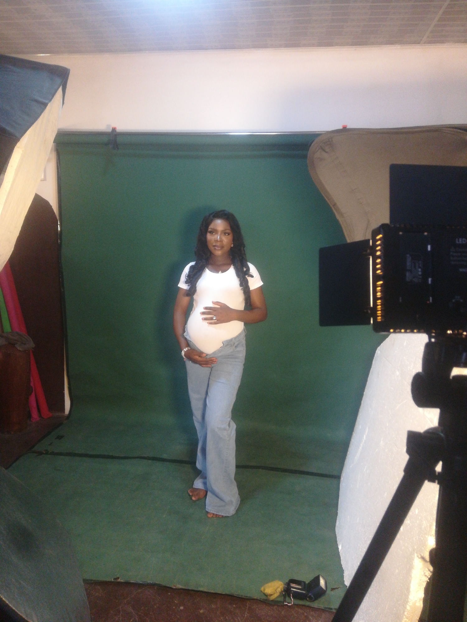 Maternity photography session captured at professional studio