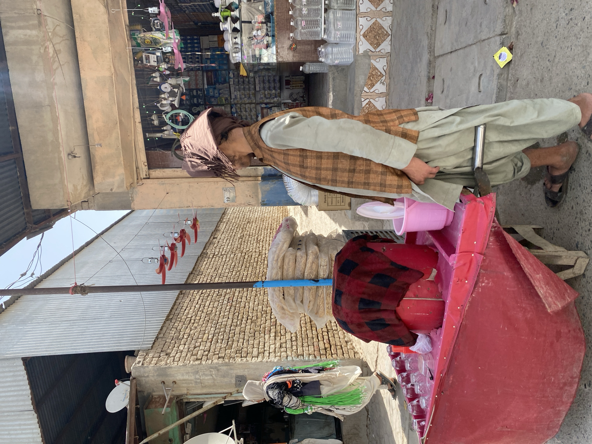 A busy morning along Kandahar's commercial streets and market stalls.