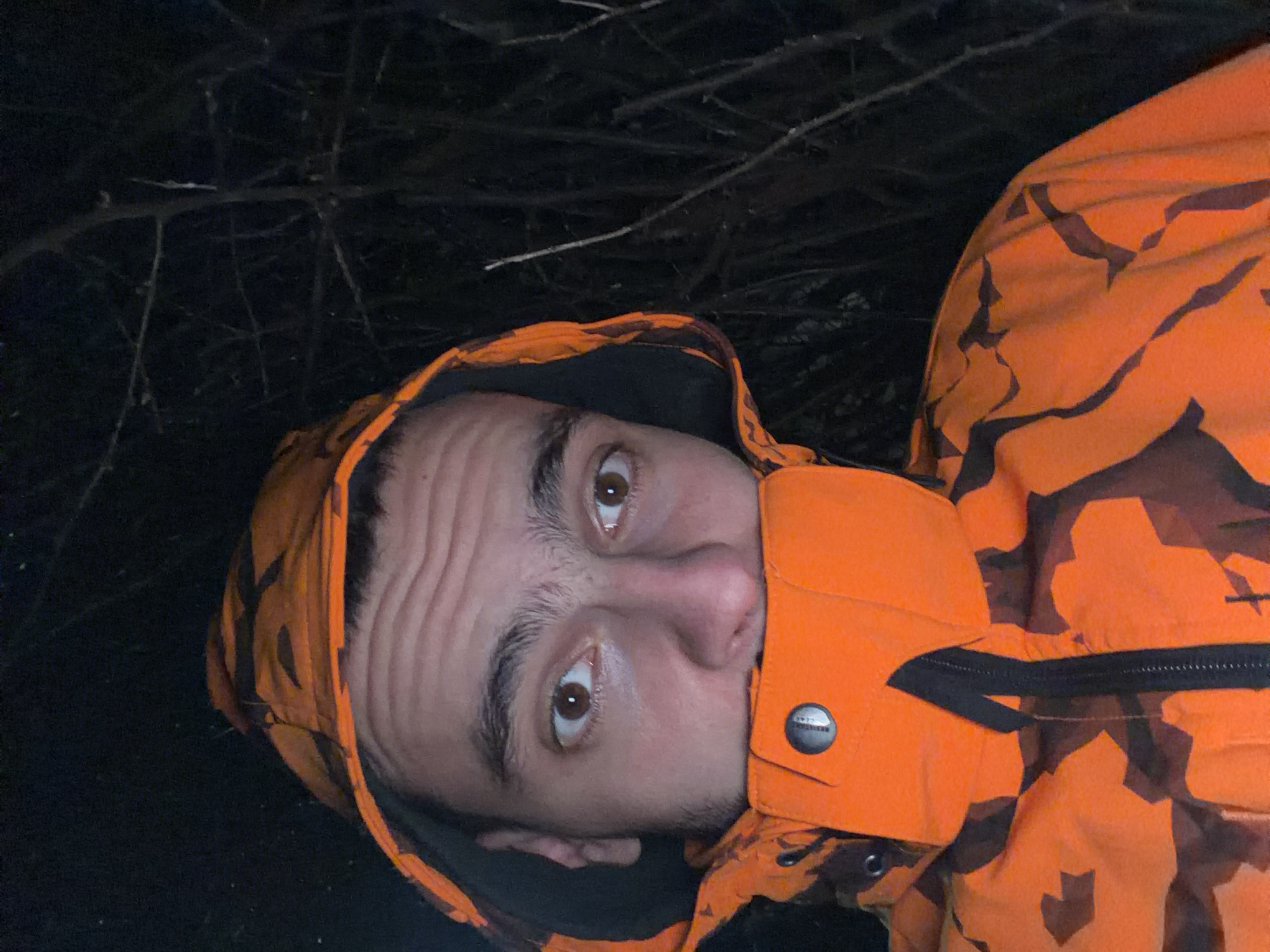 Man in orange camouflage jacket photographed outdoors in Slivnitsa