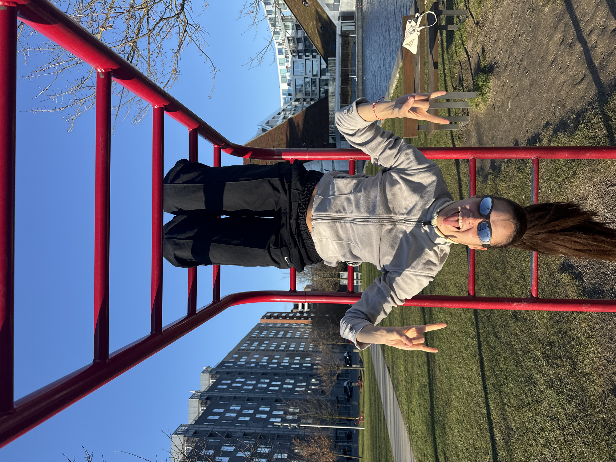 Person practices parkour and martial arts by Copenhagen waterfront
