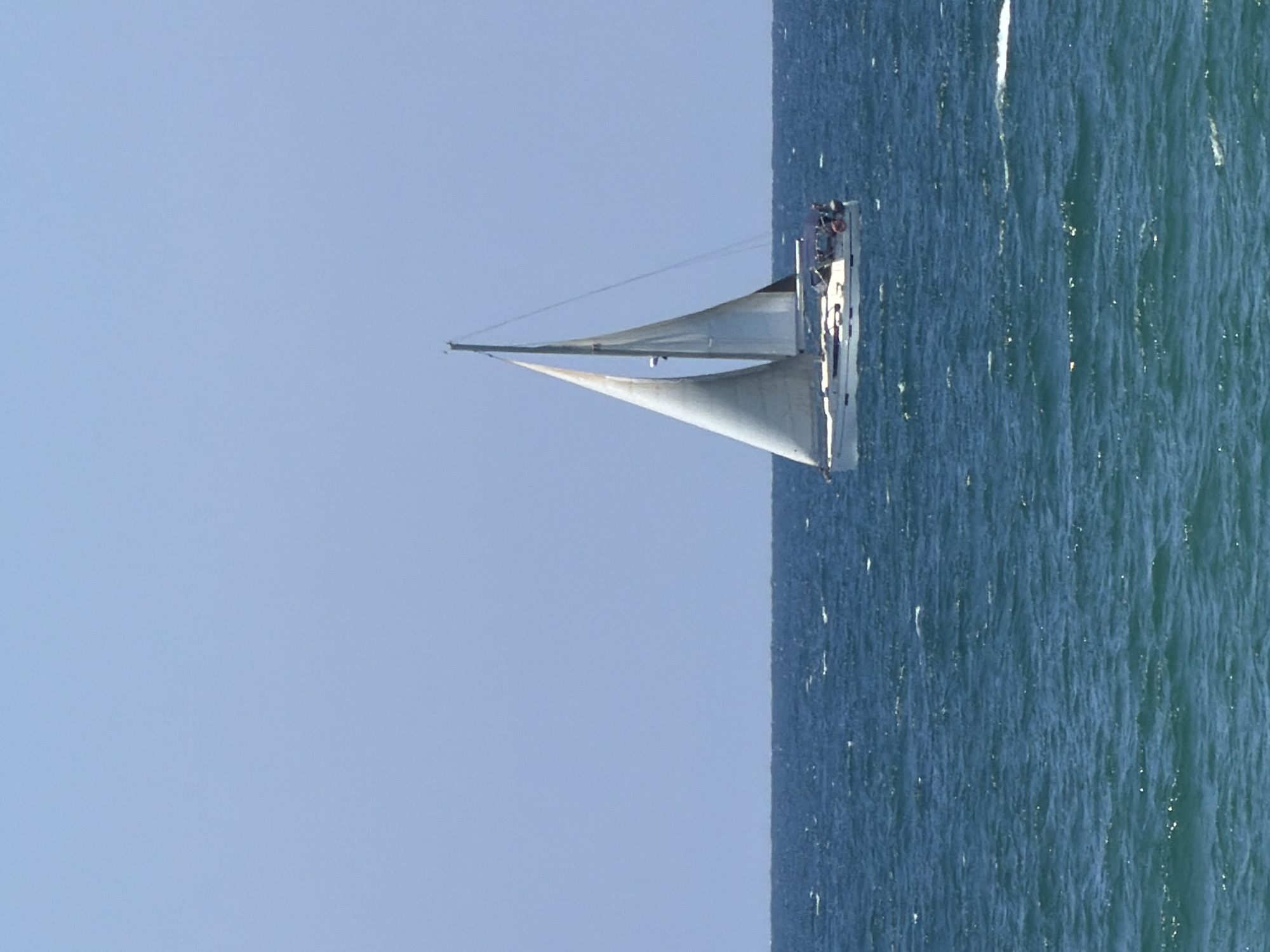 Morning recreation along Tel-Aviv coast captures sailing and cycling
