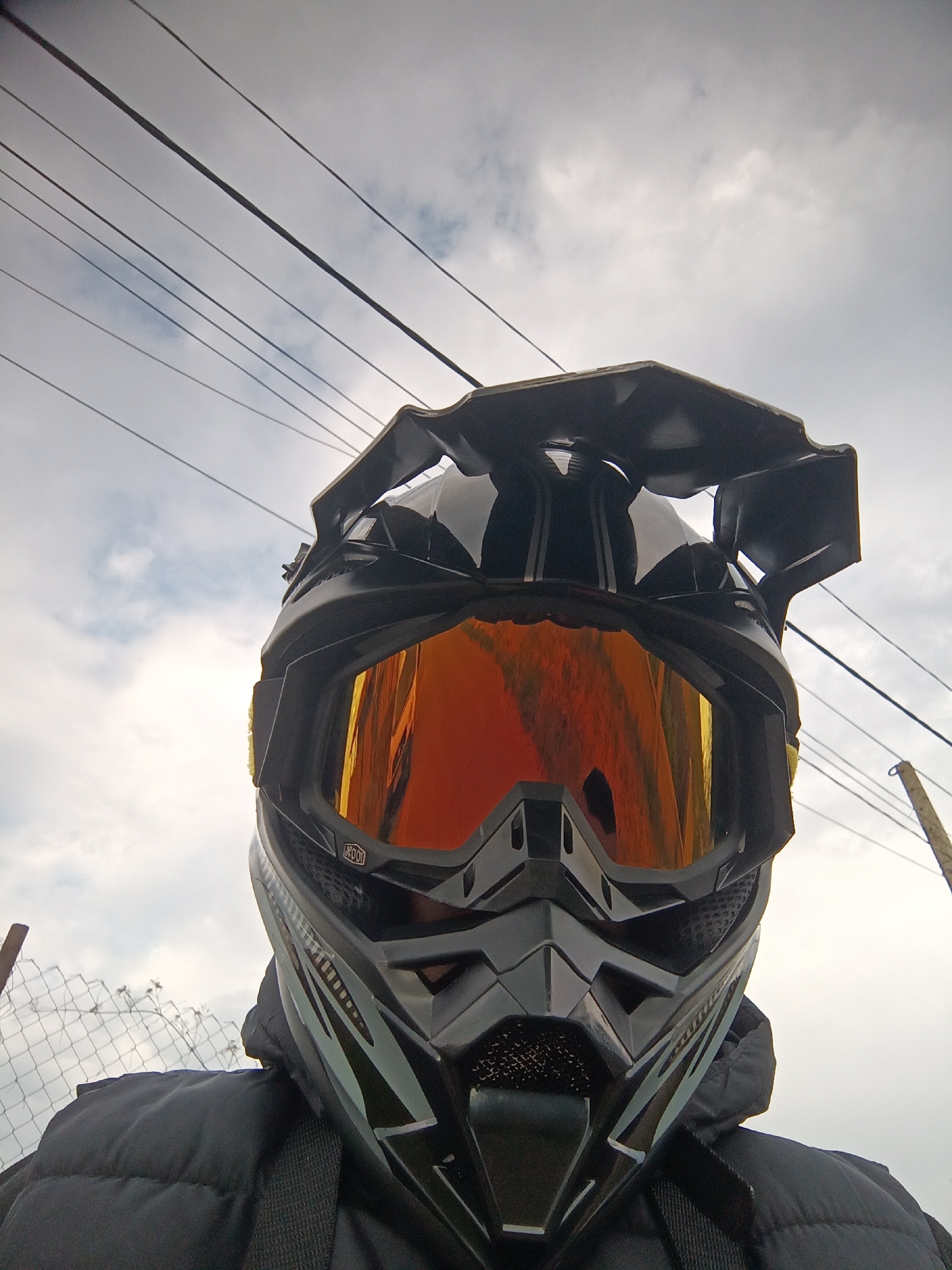 Motorcyclist in protective gear photographed at close range