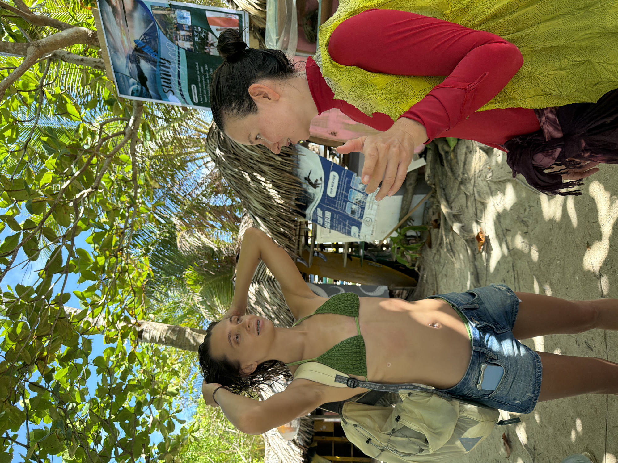 Two women photographed at beach in General Luna, Philippines