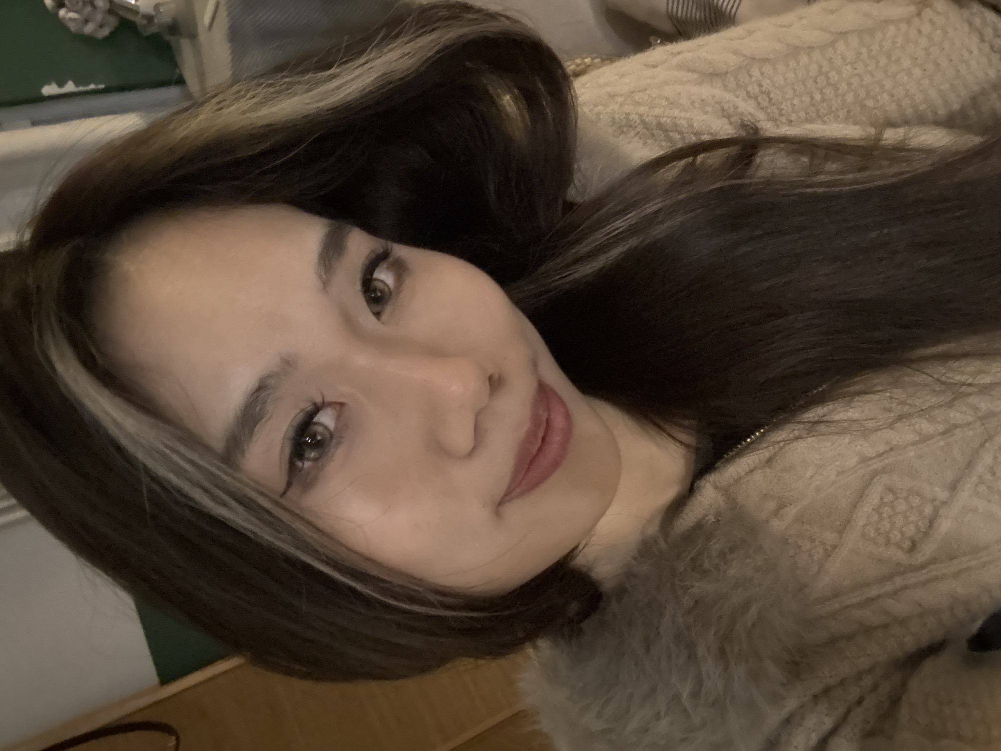 Woman takes multiple portraits and selfies indoors in China