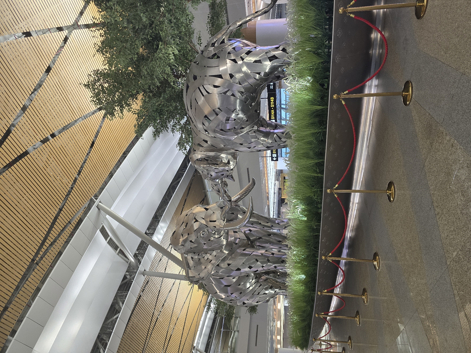 Metal bull sculptures displayed indoors in Thailand