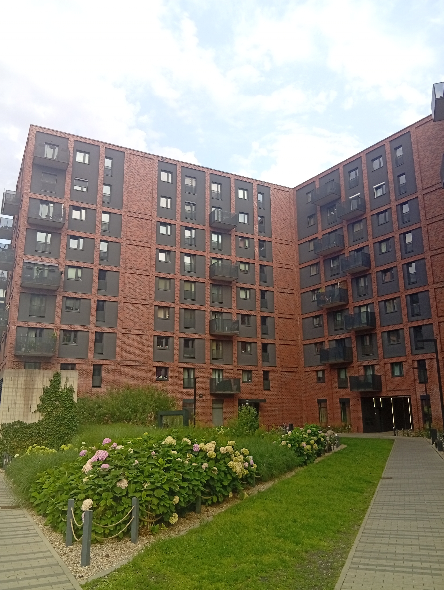Inside Wrocław's Portowice residential complex, late afternoon