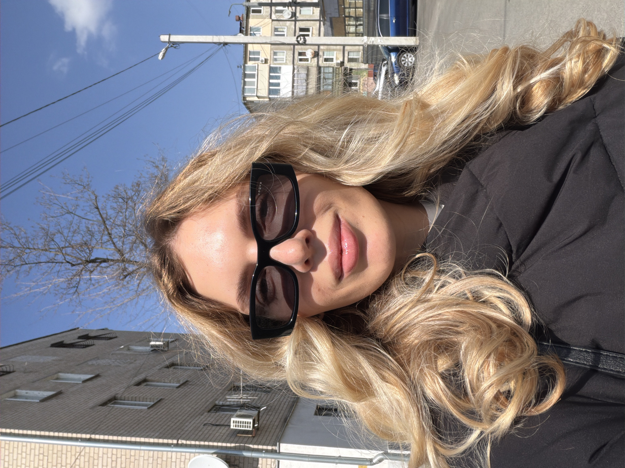 Woman poses for photos on Dnipro street