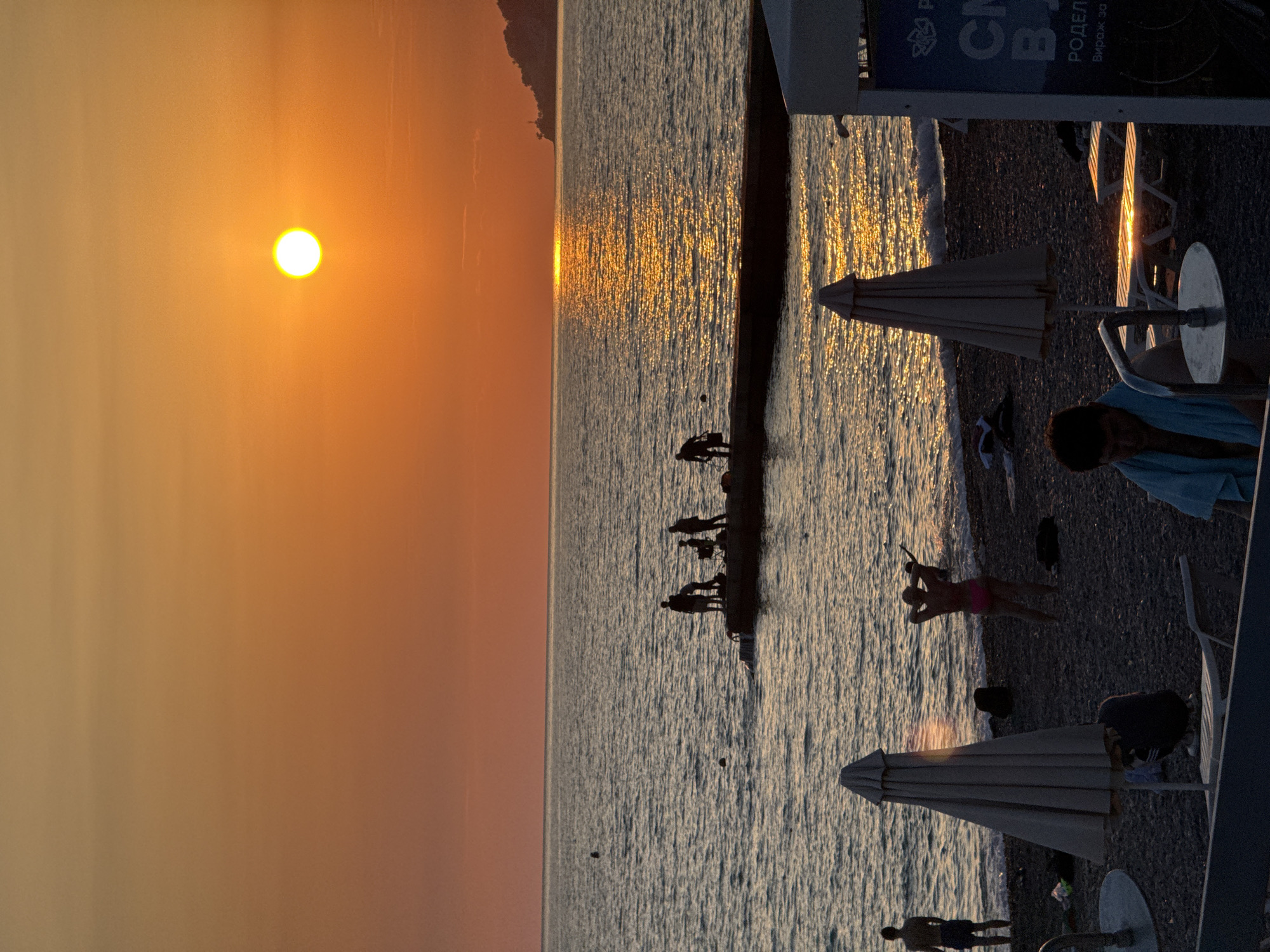 Sochi beach at golden hour, midsummer evening on the Black Sea