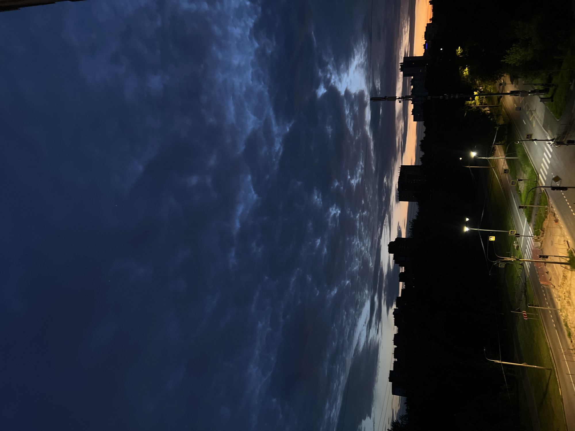 Dusk settles over Shushary's skyline, clouds and orange light