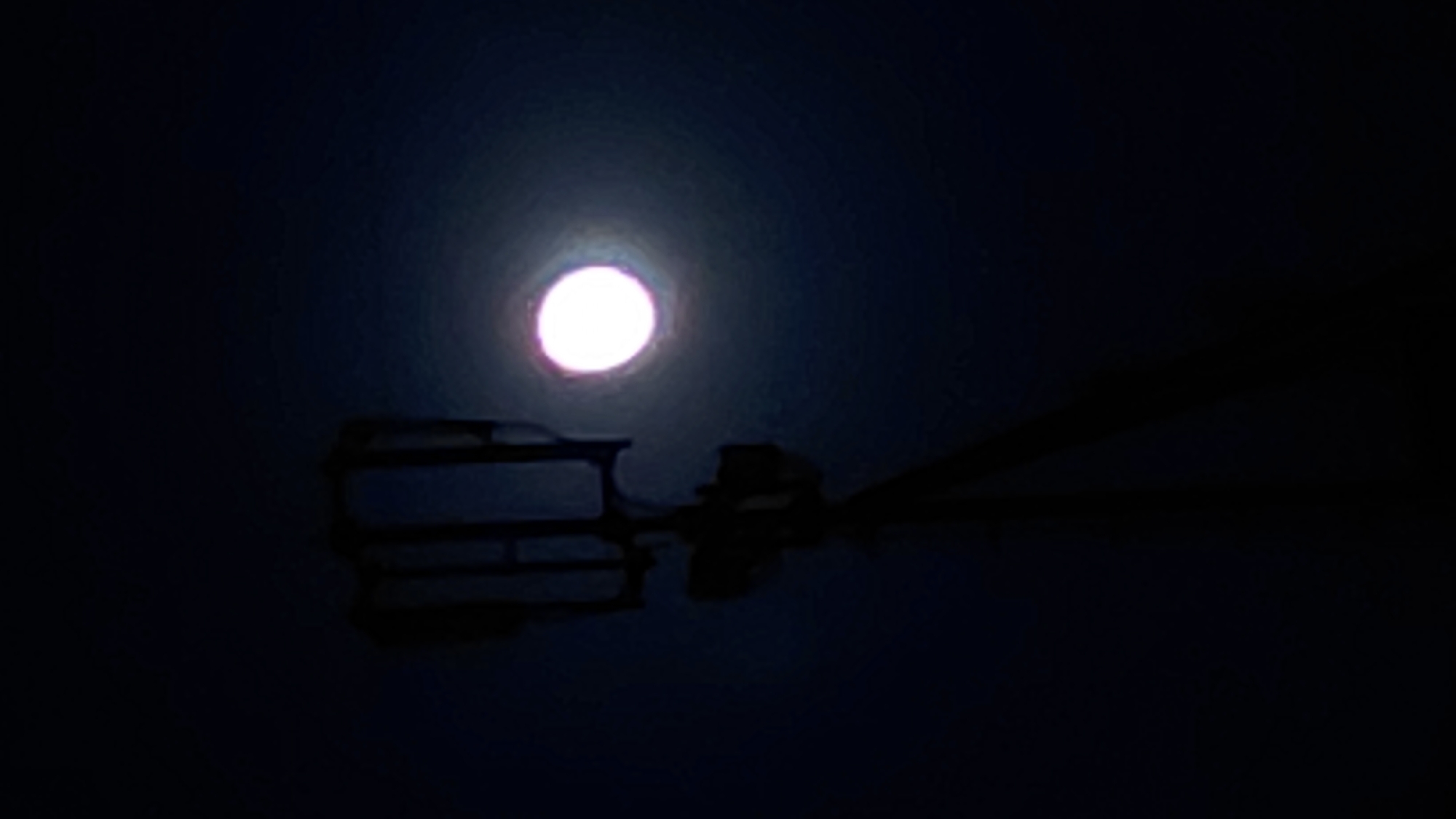 Full moon rises behind a cell tower in Abovyan, Armenia
