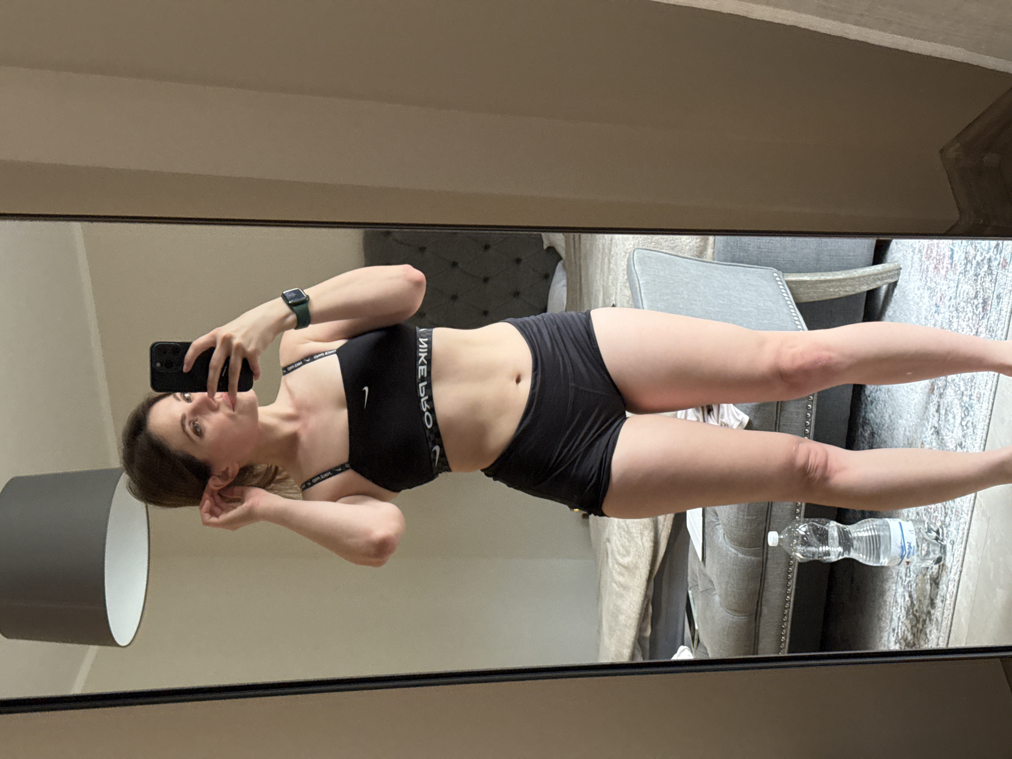 Woman takes mirror selfies in athletic wear in Karlovy Vary