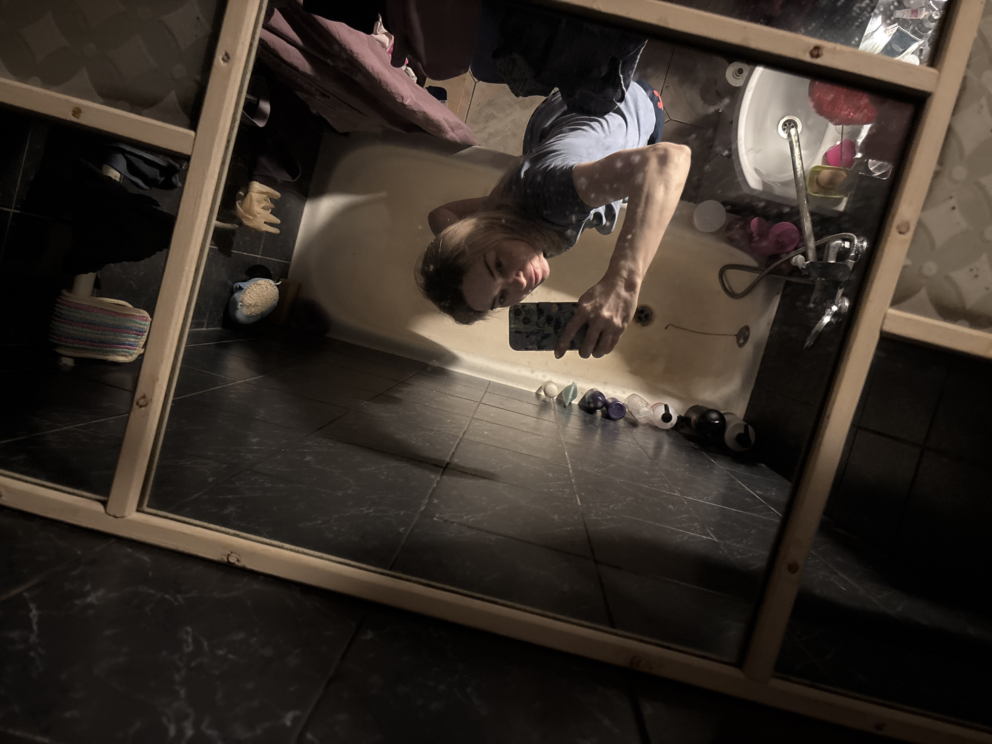Woman documents evening routine with selfies in Vsevolozhsk apartment