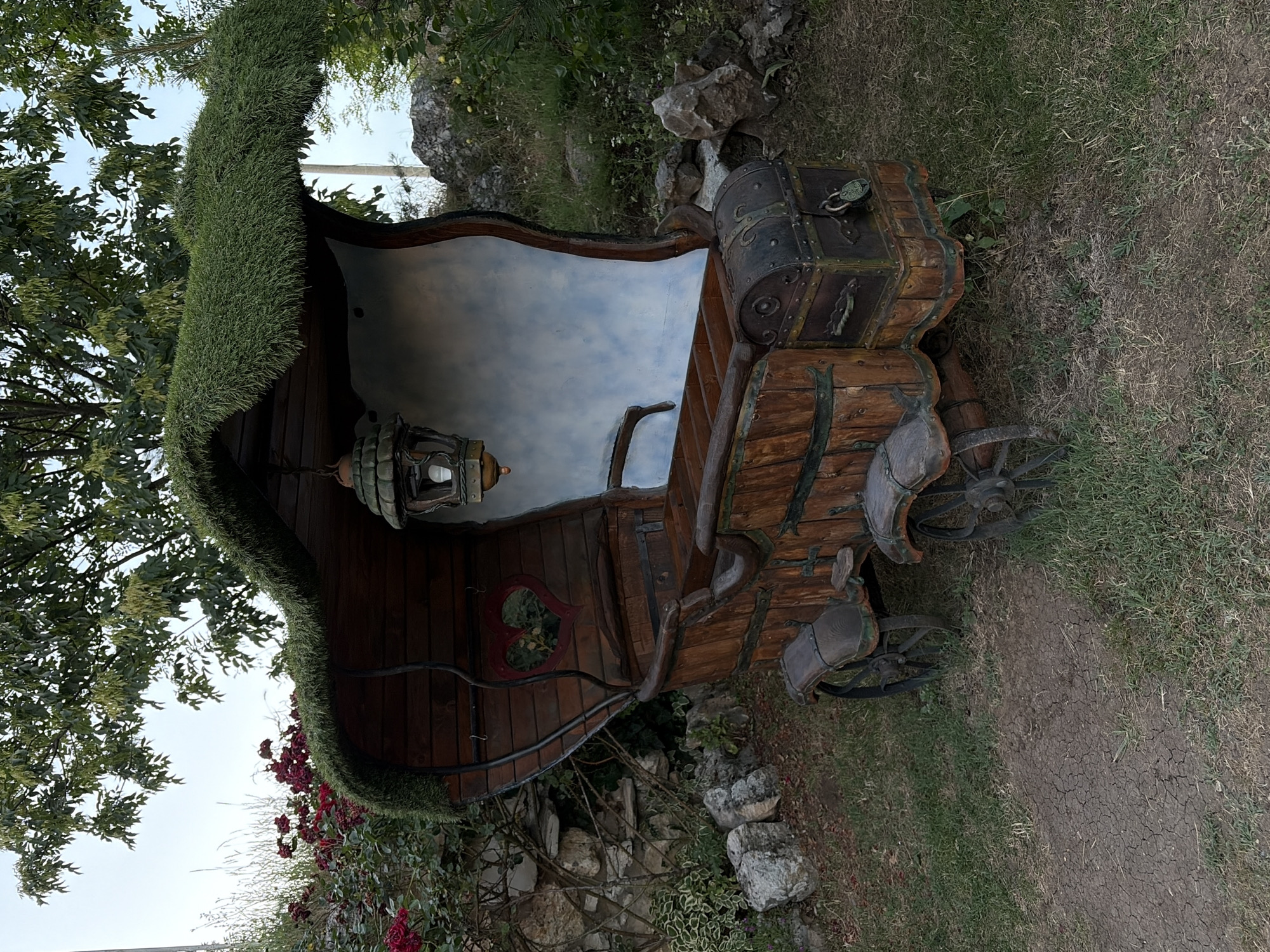 Fairytale village with hobbit houses and floating pond structures