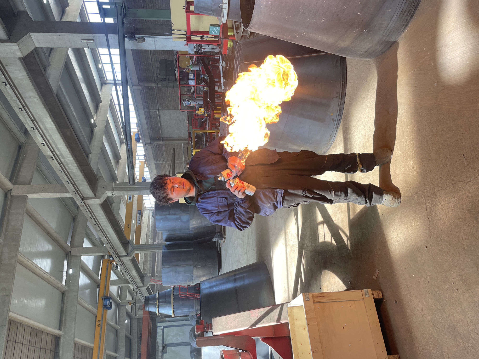 Worker conducts flame welding operations at Montenegro industrial facility