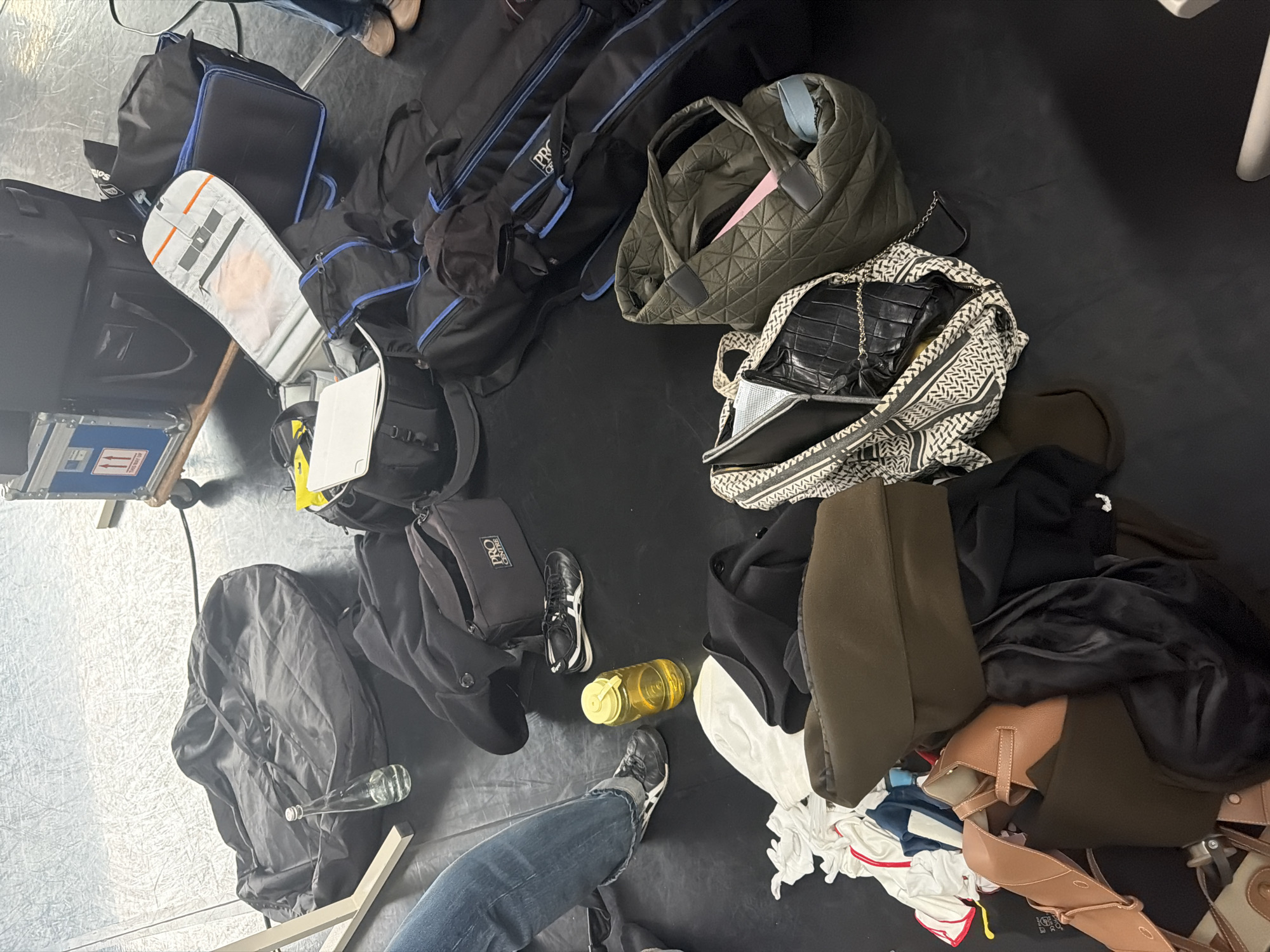 Film crew sets up equipment backstage in London studio