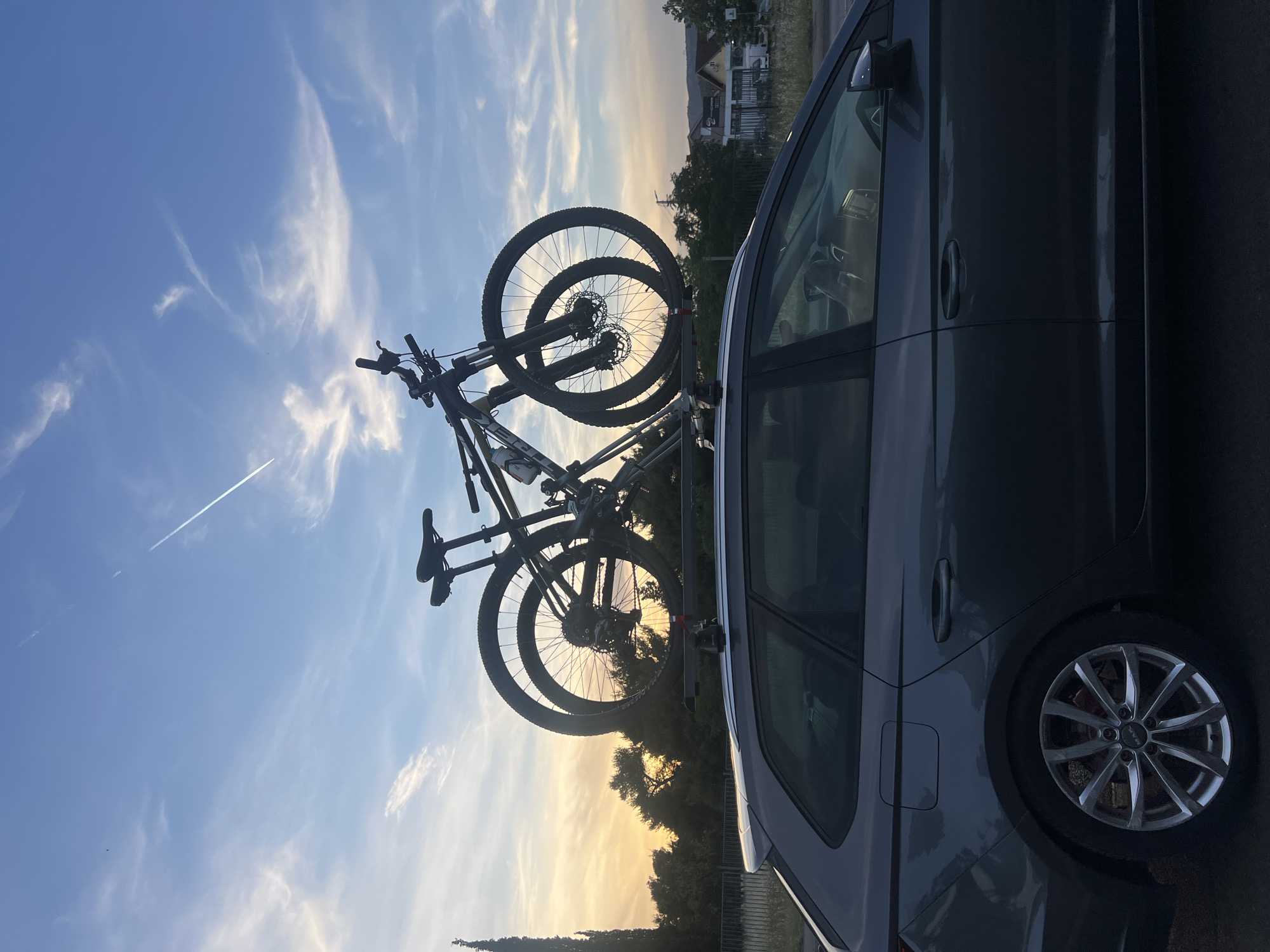 Car with roof-mounted bikes spotted during sunset in Podgorica